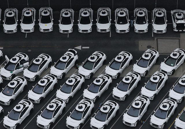 <p>Waymo cars are seen parked at a Waymo facility on 10 June, 2025 in San Francisco, California</p>