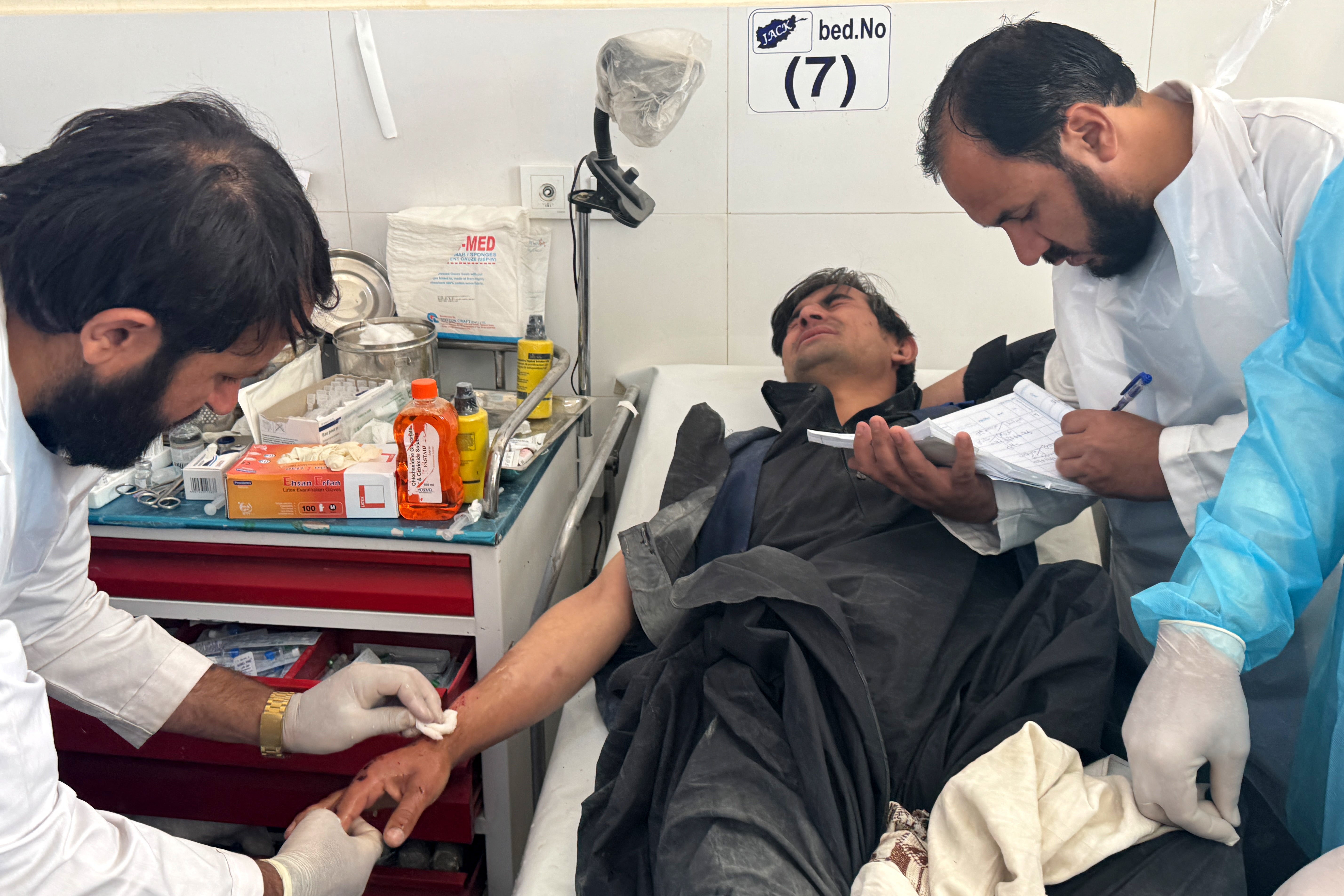 An Afghan man wounded during ongoing clashes between Afghan and Pakistani forces receives treatment at a hospital in Spin Boldak area of Kandahar