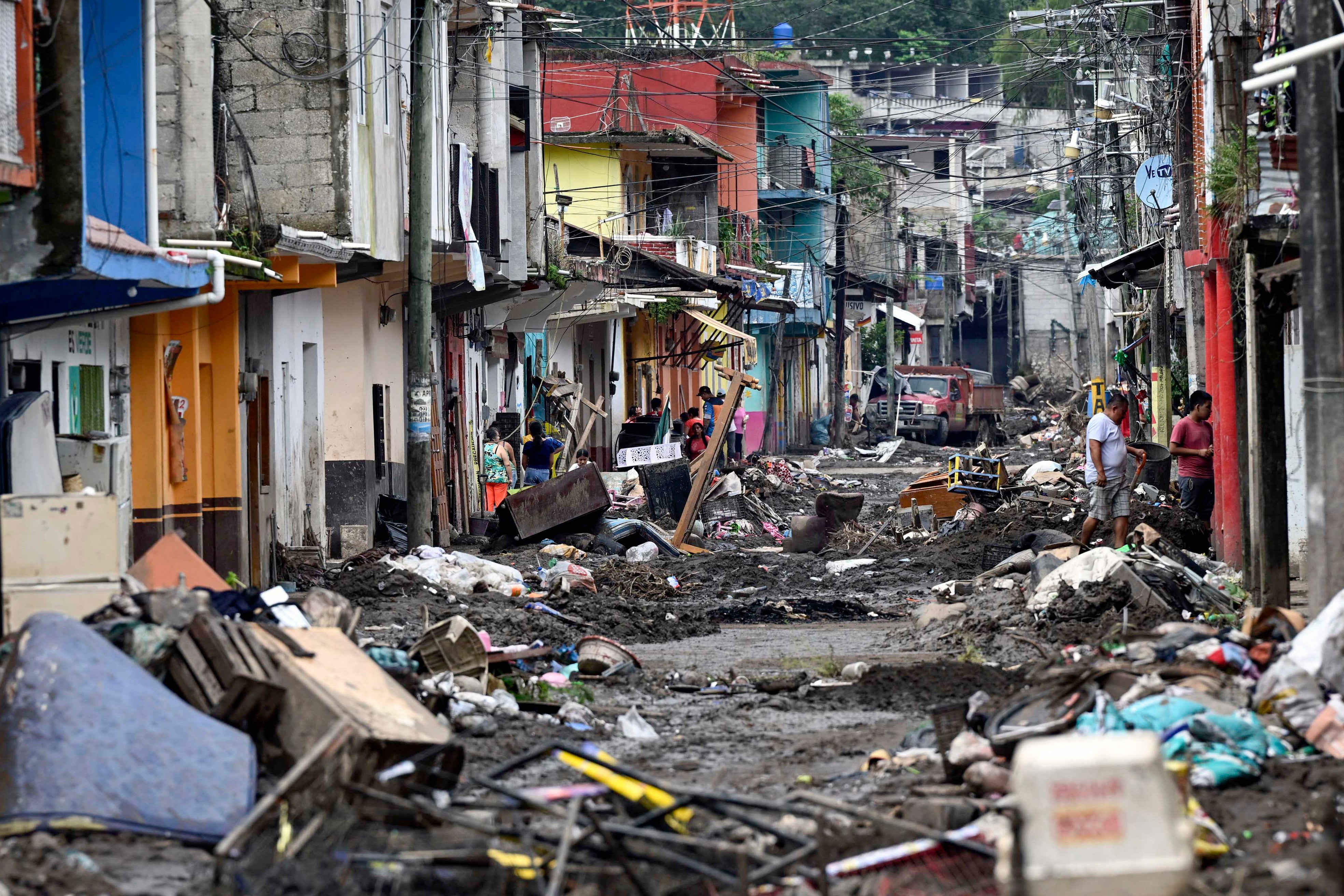 A destroyed street after flooding caused by heavy rains in the town of Huehuetla, in Hidalgo state