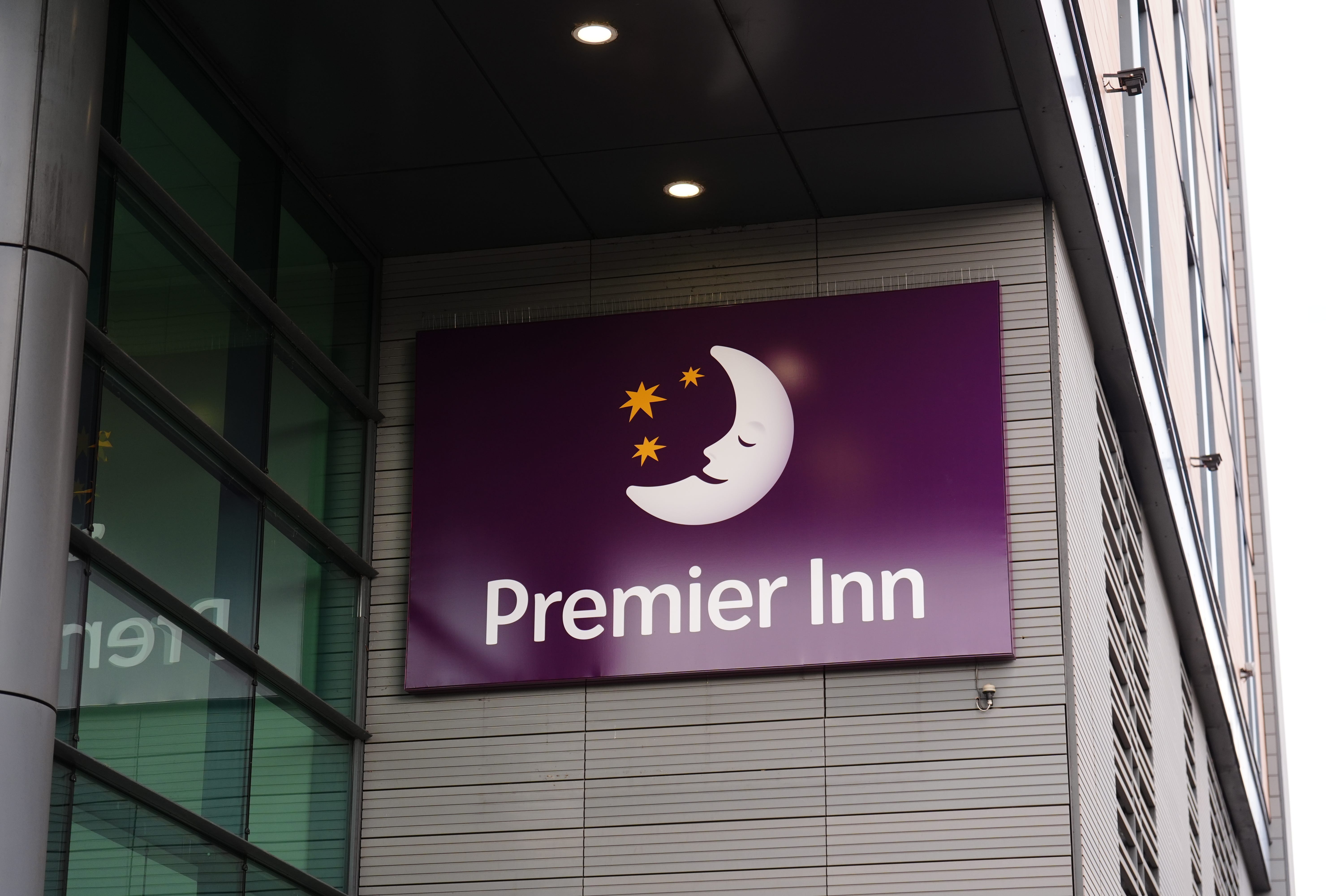 Premier Inn’s owner has reported lower earnings and sales in the UK (Mike Egerton/PA)