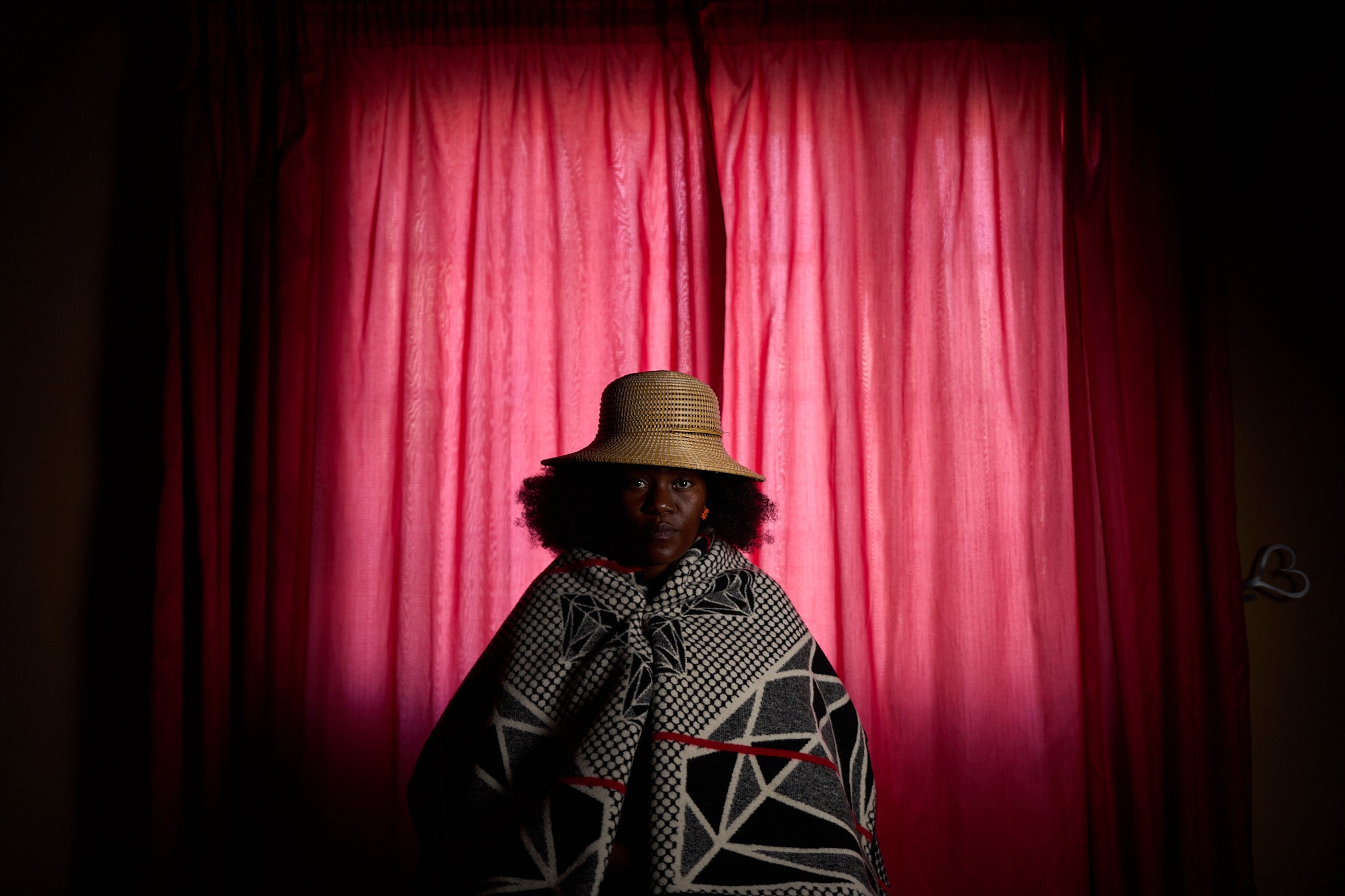 Rethabile Motsamai, 37, who lost her job as an HIV counselor after the USAID cuts, poses for a portrait in Maseru, Lesotho, Sunday, July 20, 2025. Motsamai, a mother of two, has worked since 2016 for U.S.-funded organizations helping people living with HIV across Lesotho. In January, her HIV counselor role was eliminated, leaving many of her patients in isolated communities without access to services. "They'll just stop taking their medication," she said. As of October, Motsamai remained unemployed but hoped she might be hired again. (AP Photo/Bram Janssen)