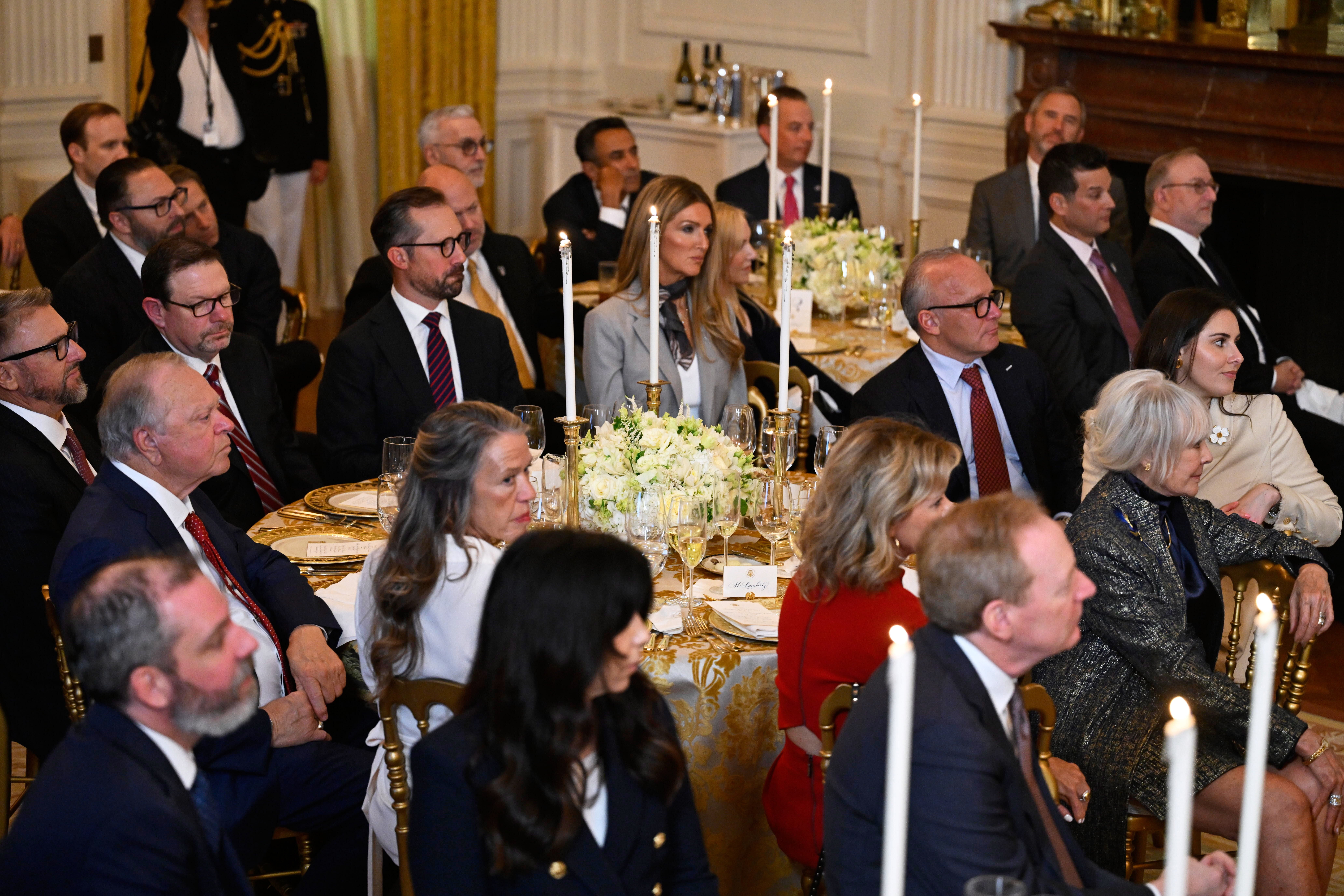 Guests from tech, defense and finance worlds, listen as Trump addresses a dinner for donors who have contributed to build the new ballroom at the White House