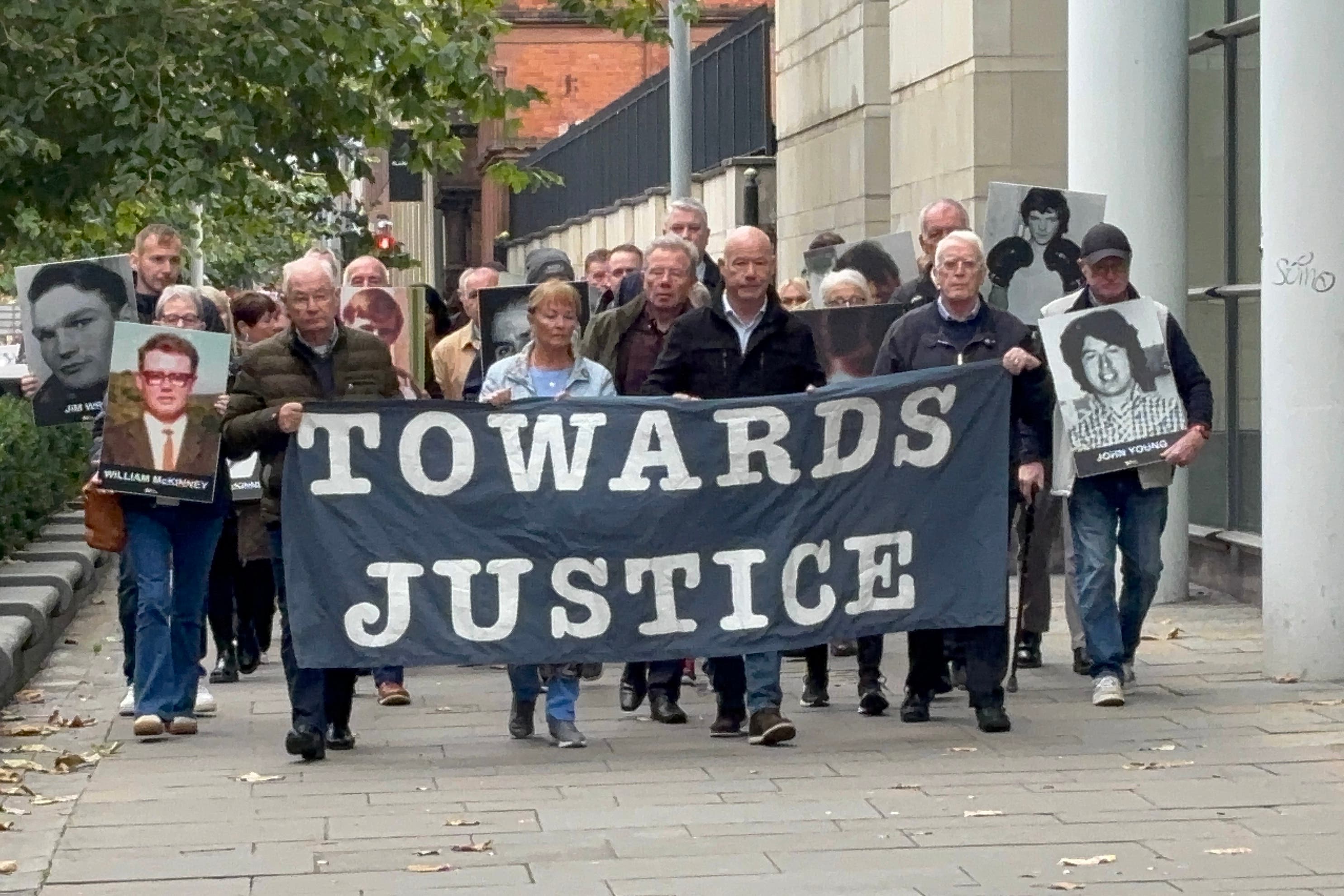 The families of James Wray and William McKinney and supporters arrive at Belfast Crown Court on Thursday morning for the trial of a former paratrooper known as Soldier F who is accused of their murder during the events of Bloody Sunday in Londonderry in 1972 (Rebecca Black/PA)