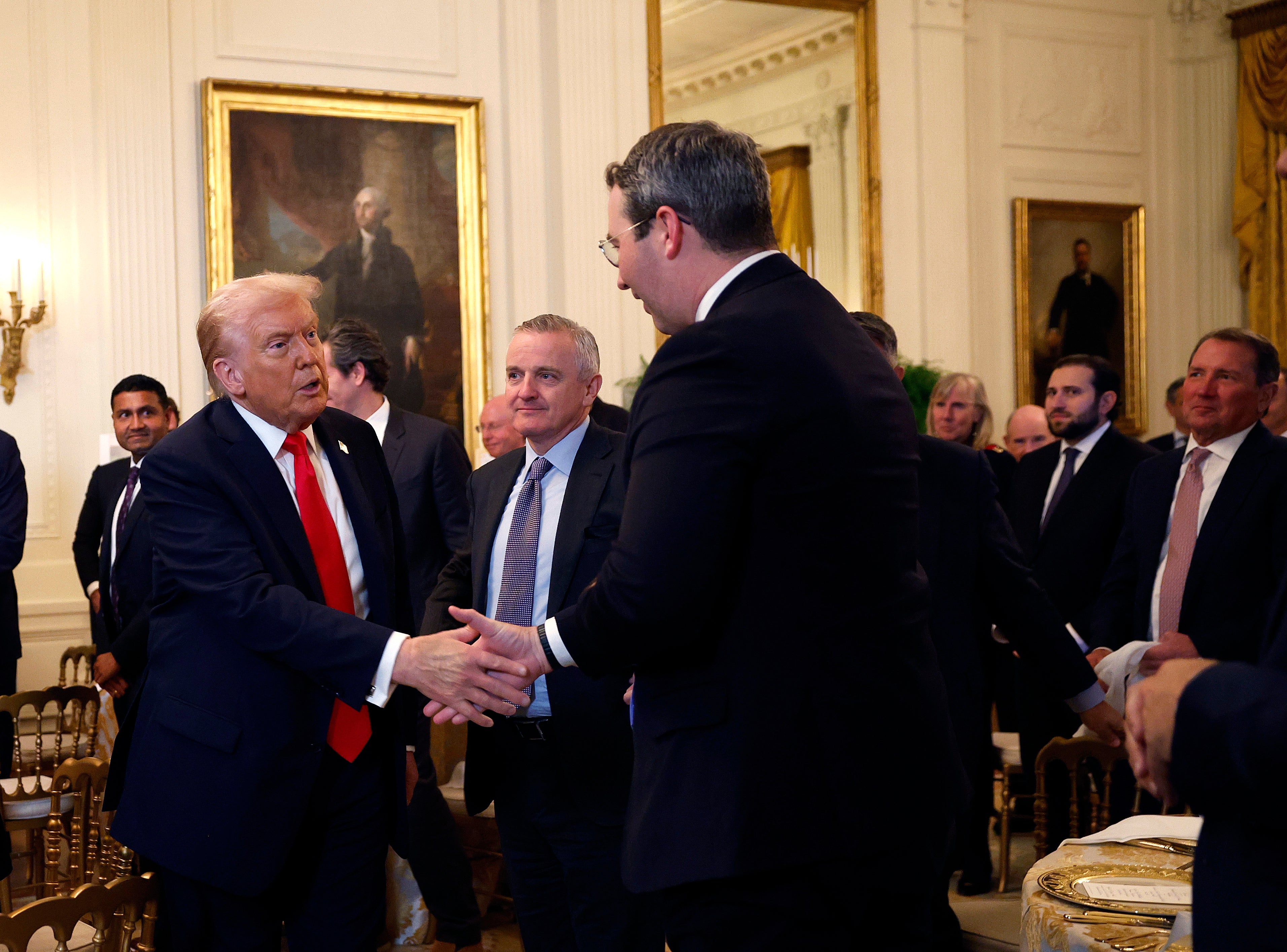 Trump invited dozens of donors helping to bankroll the under-construction ballroom with gold-lettered invitations. In attendance were representatives from Lockheed Martin, Microsoft, Meta, Alphabet’s Google, Amazon and Palantir Technologies