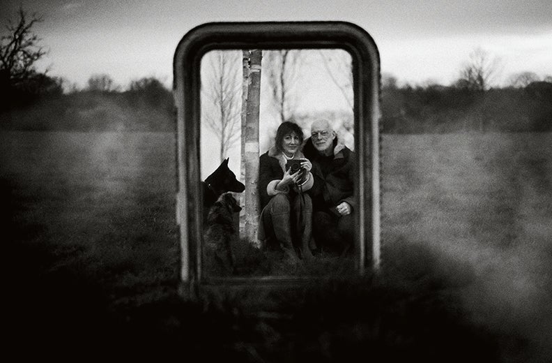 Samson, Gilmour and their dogs reflected in a large mirror