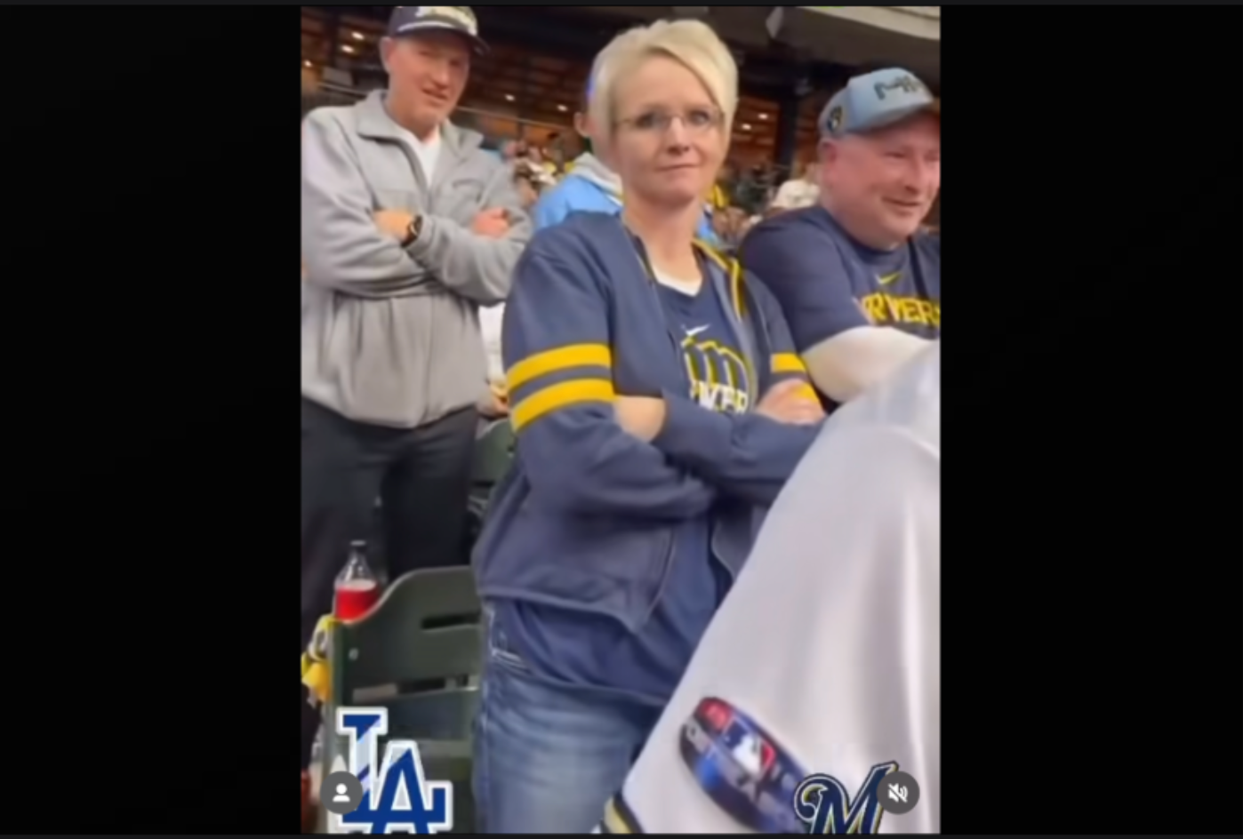 A Brewers fan lost her job after suggesting she should 'call ICE' on a Latino Dodgers fan during a playoff game