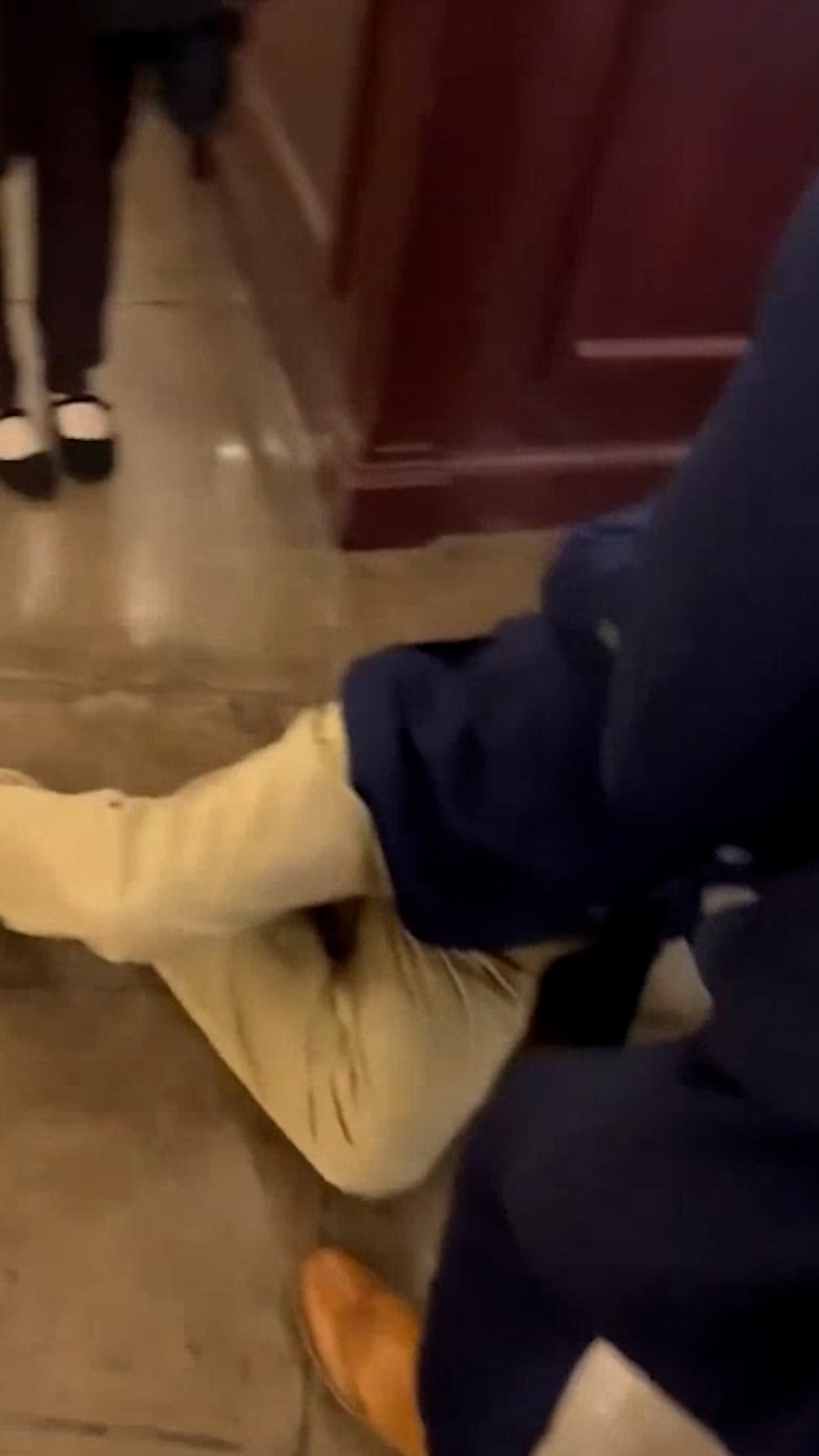 The Senator had to be helped up by Capitol Police and staff members.