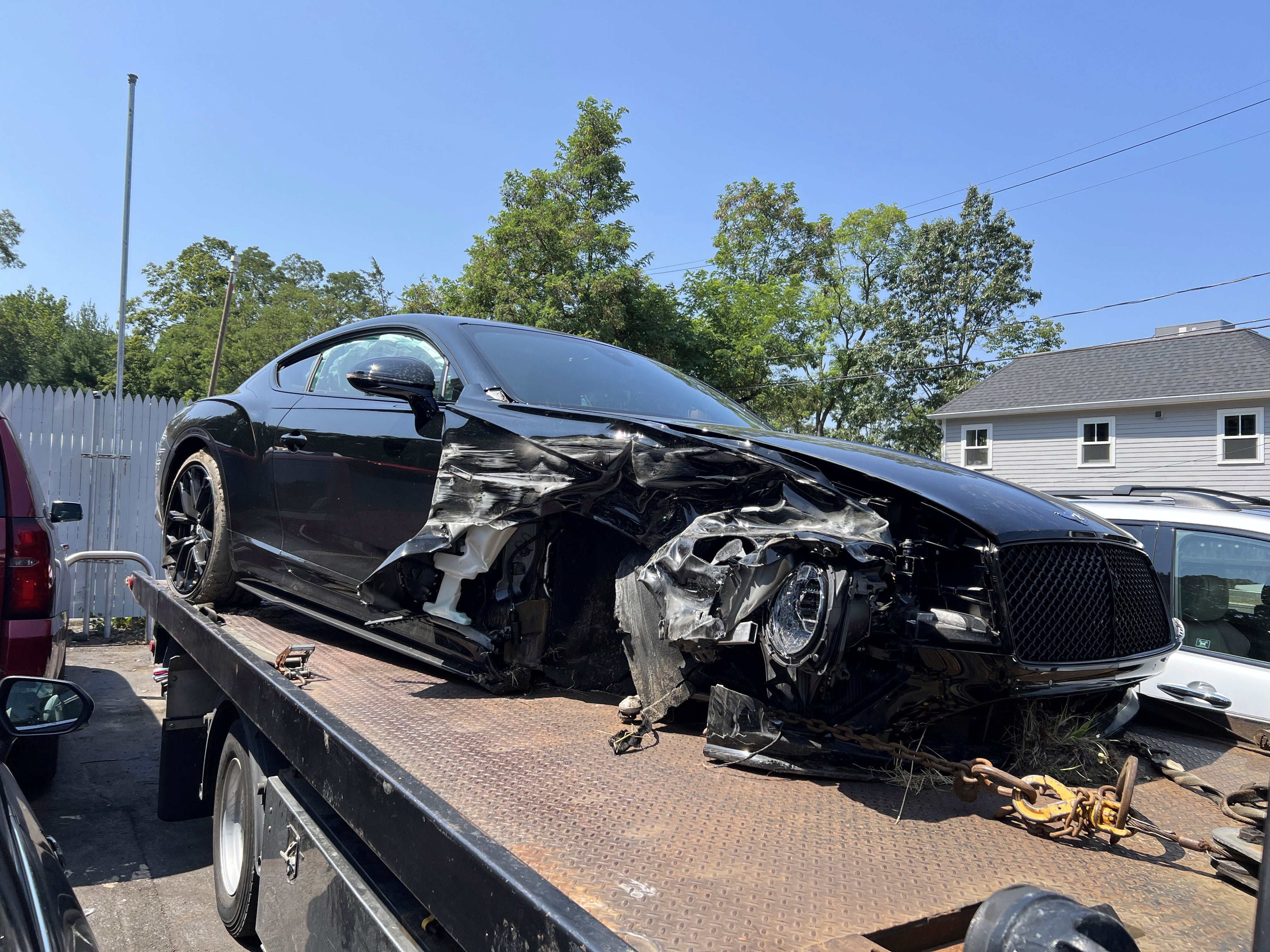 Vince McMahon's damaged vehicle on a tow truck in Westport, where the car was towed to after the crash