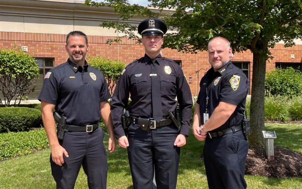 Hanover Park Police Officer Radule Bojovic (center) was arrested by ICE agents Thursday