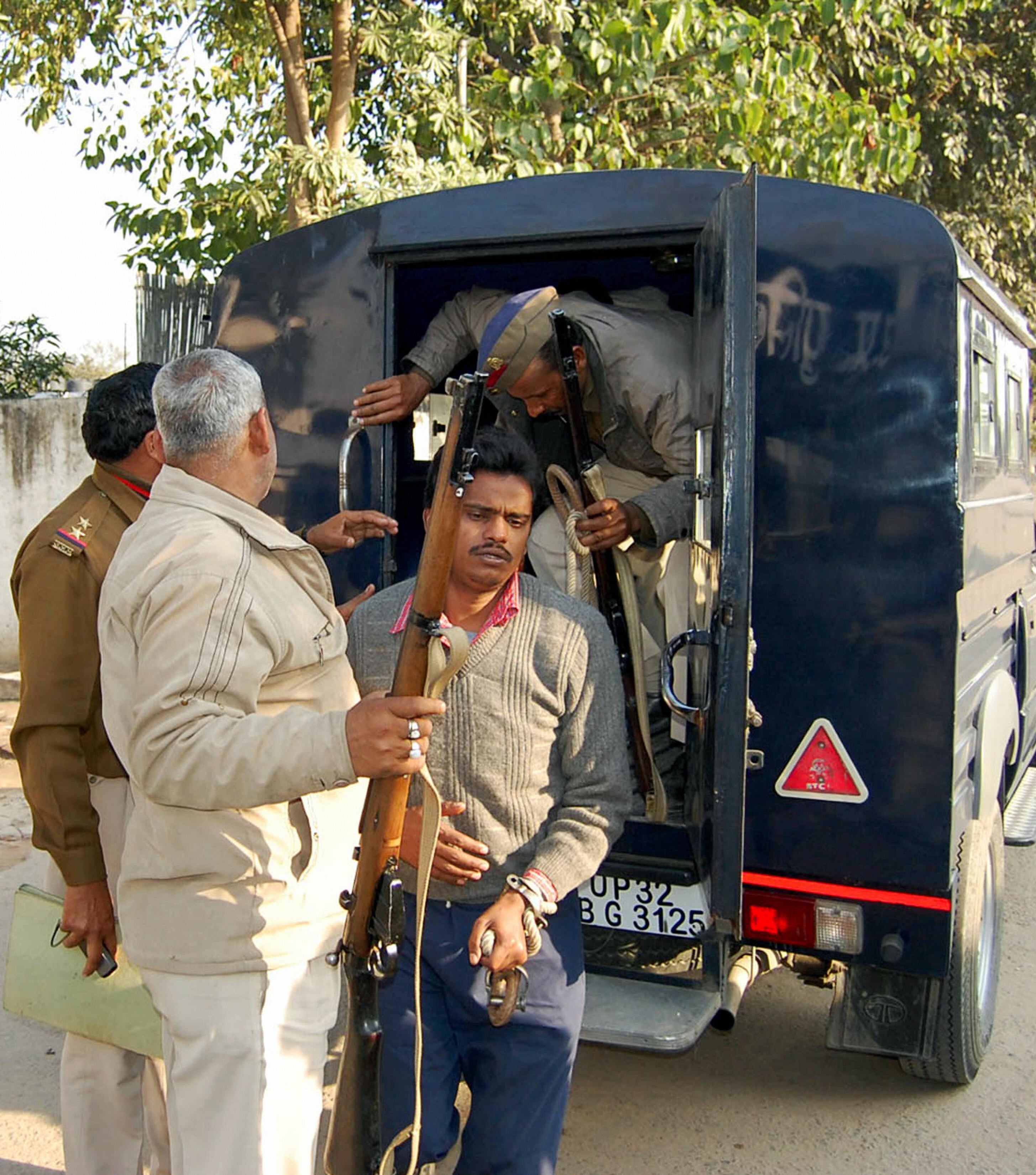 <p>Surinder Koli, accused in a case involving the gruesome deaths in Nithari, is escorted to court in Ghaziabad on the outskirts of New Delhi on 12 February 2009</p>