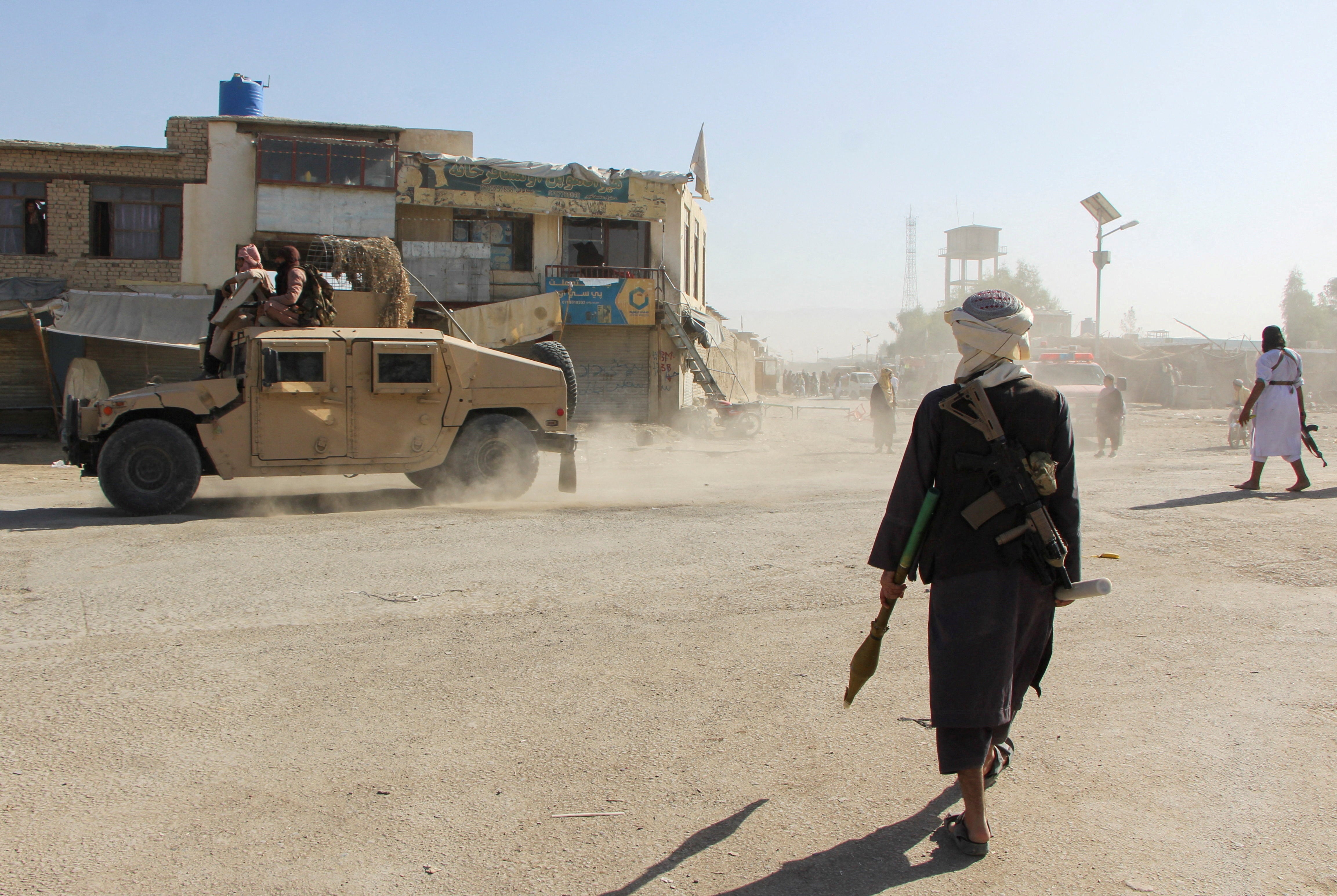 Afghan Taliban fighters patrol near the Afghanistan-Pakistan border in Spin Boldak, Kandahar Province, following exchanges of fire between Pakistani and Afghan forces in Afghanistan, 15 October 2025