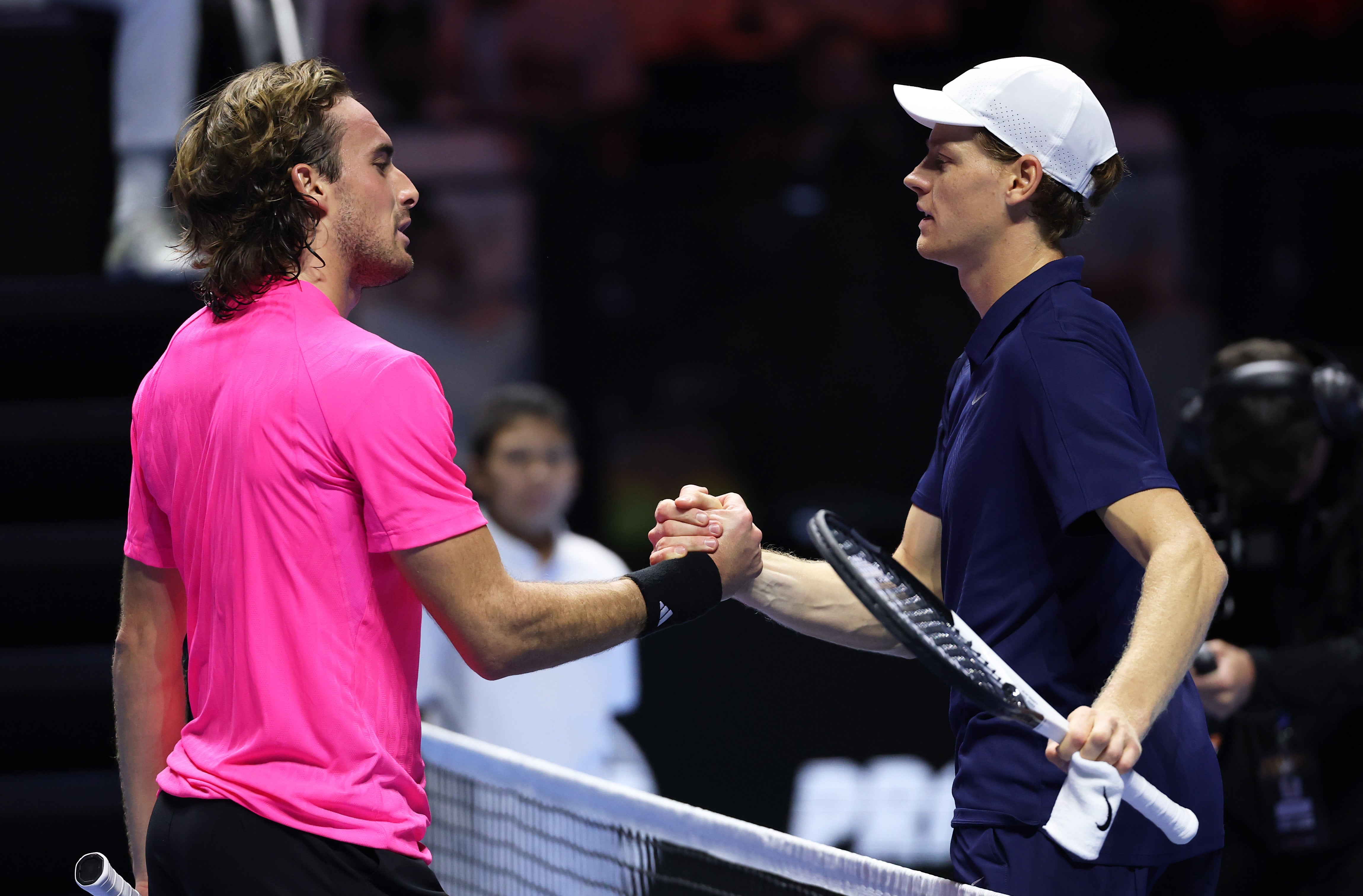 Jannik Sinner of Italy shakes hands at the net after his straight sets victory against Stefanos Tsitsipas