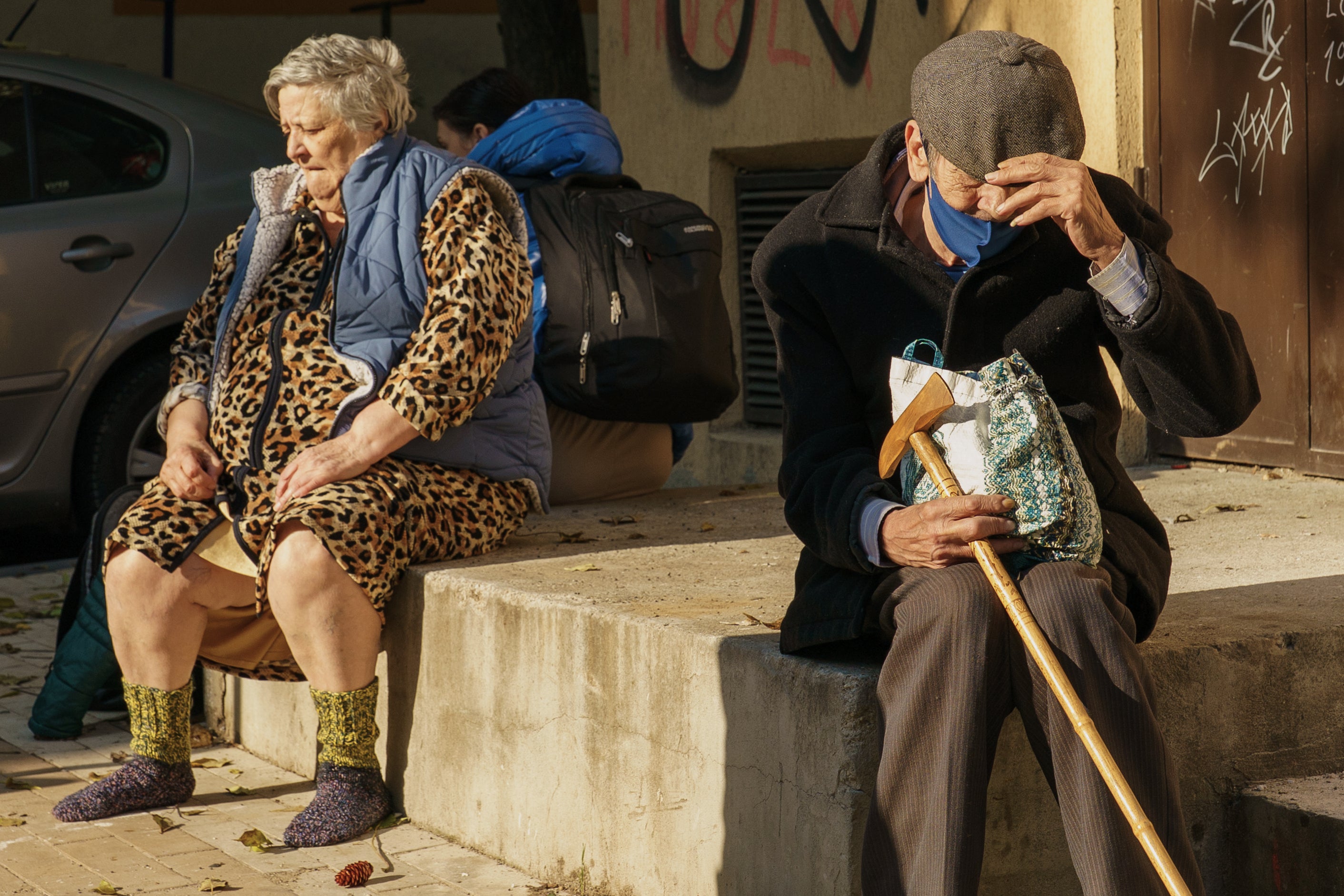 Shocked residents are seen in front of a damaged apartment building after a powerful explosion in a residential block in Bucharest, Romania, Friday, Oct. 17, 2025. (AP Photo)