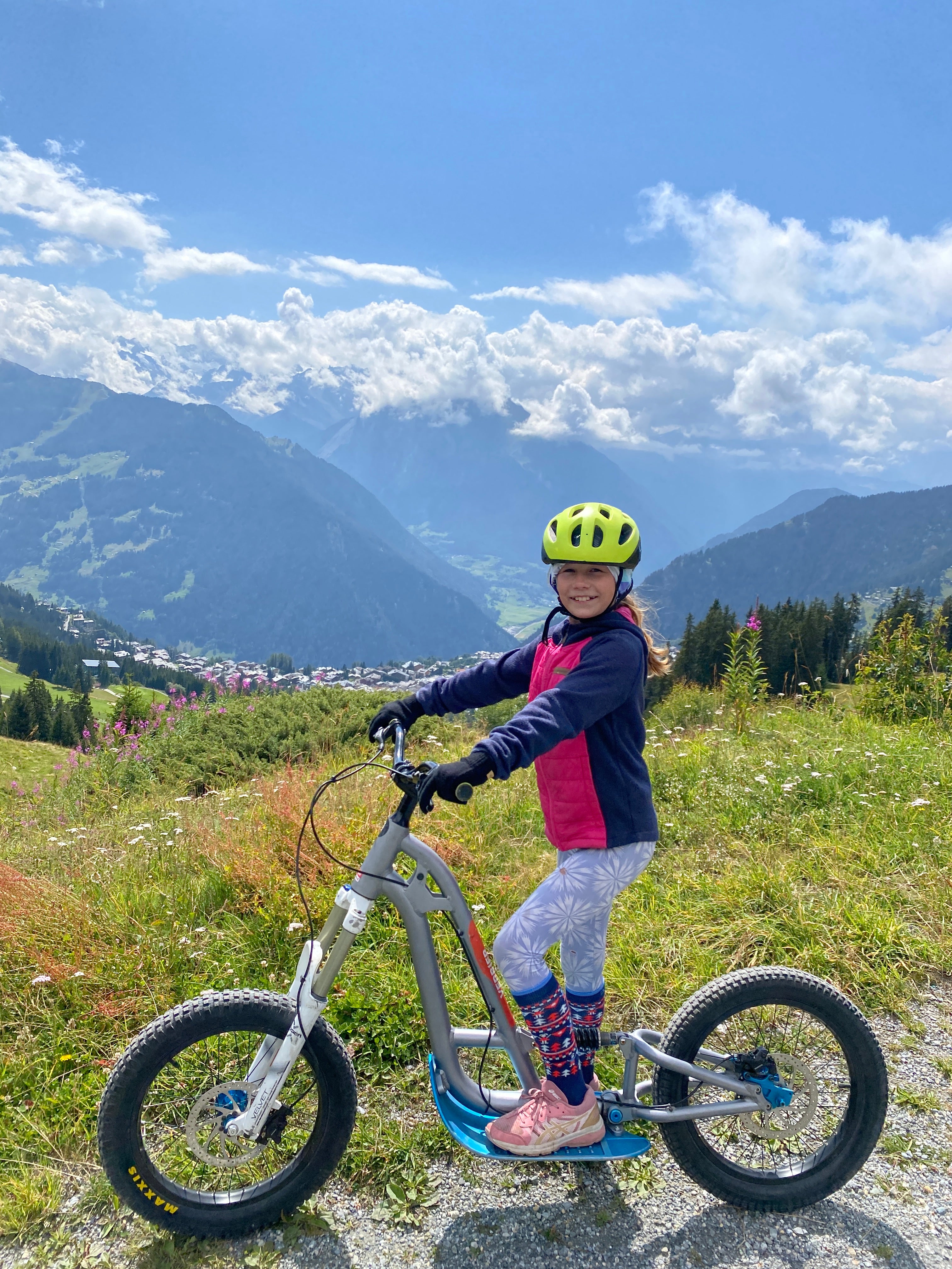 Lotte scootering through the Alps