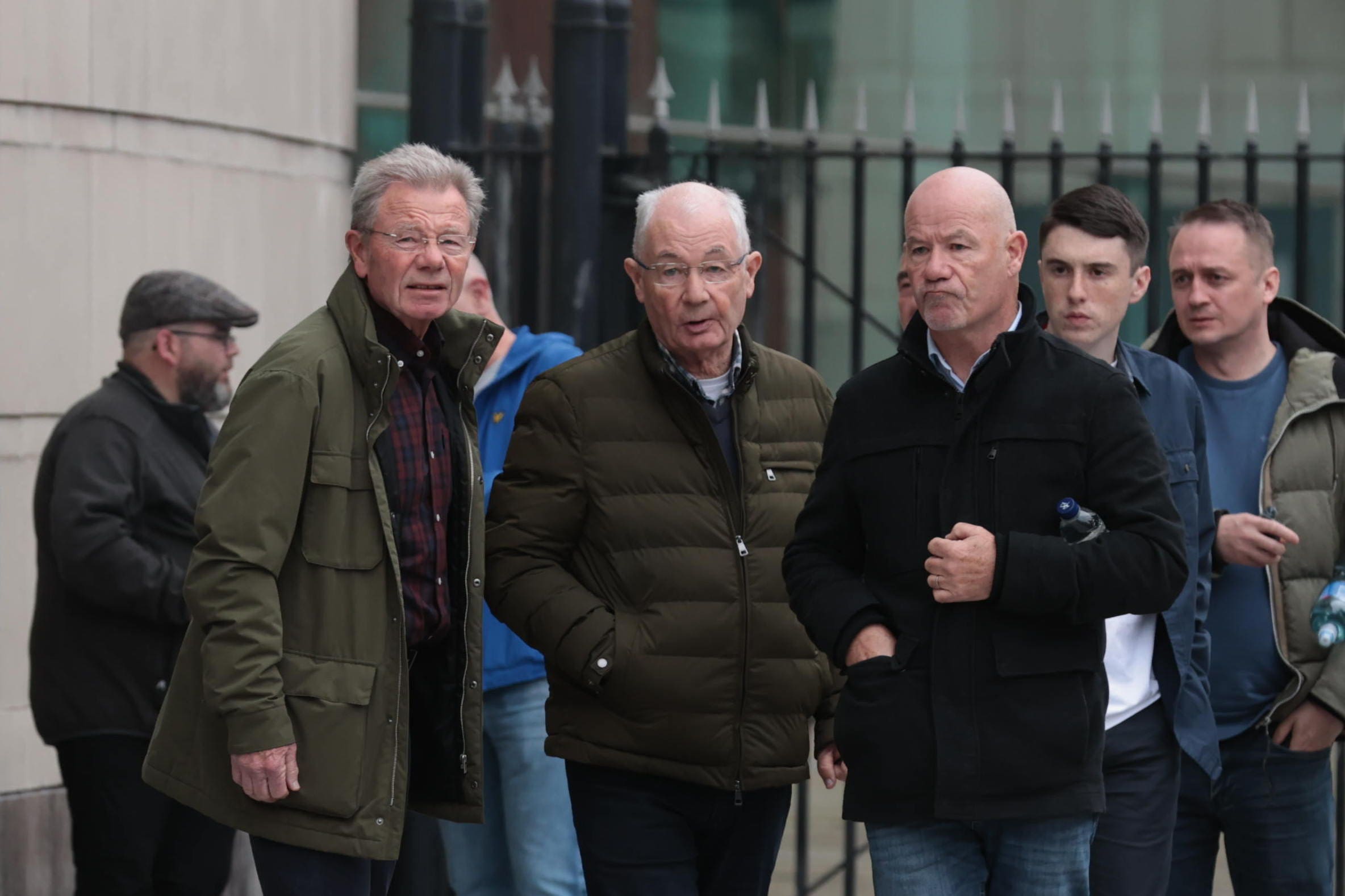 (left to right) Joe, Mickey and John McKinney, the brothers of victim William McKinney, leaving Belfast Crown Court at the end of the trial of a former paratrooper (Liam McBurney/PA)