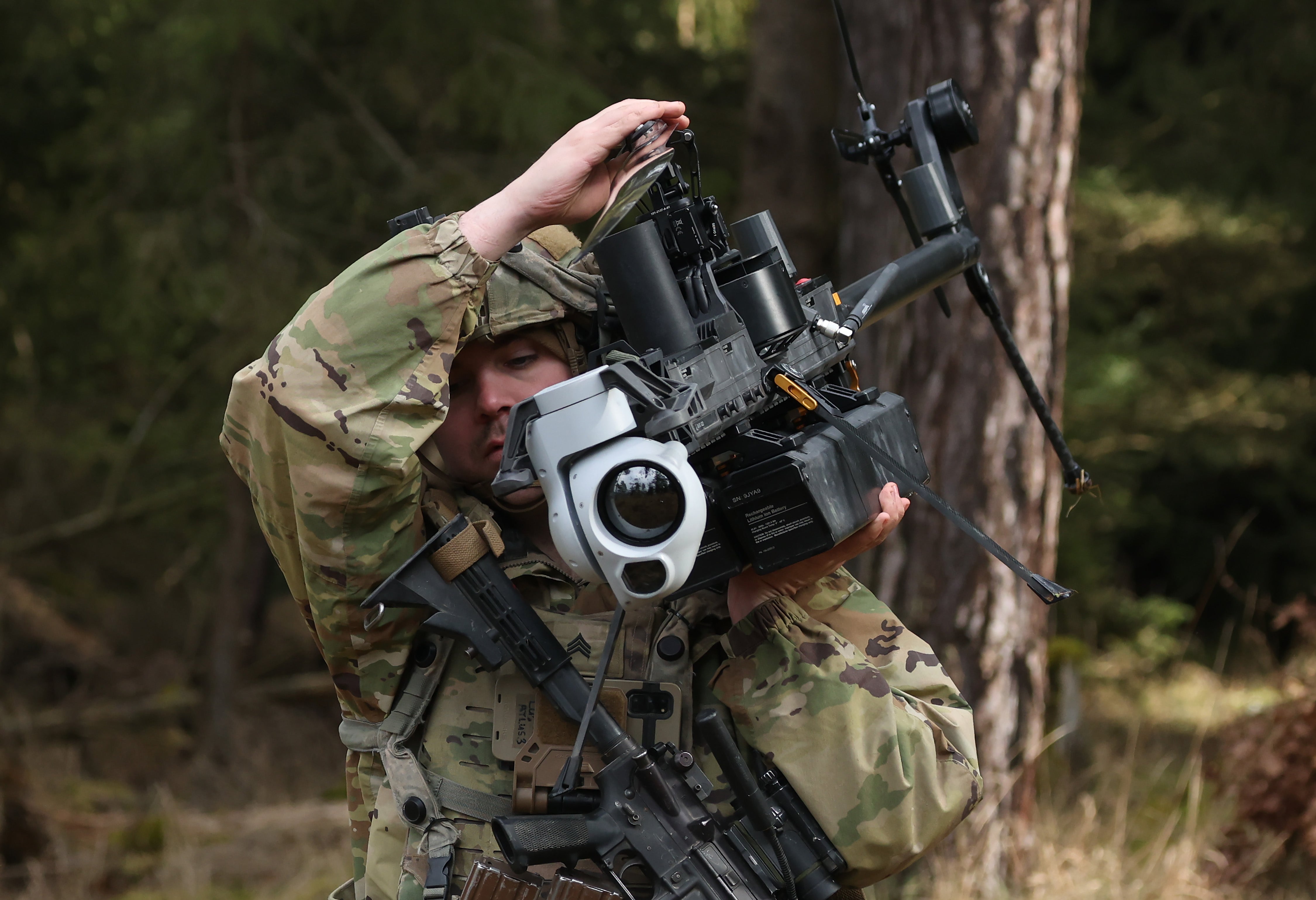 Drones like this Anduril Ghost-X surveillance helicopter, seen here being carried by a U.S. Army soldier on exercises in Germany, have had a lethal impact in the war in Ukraine