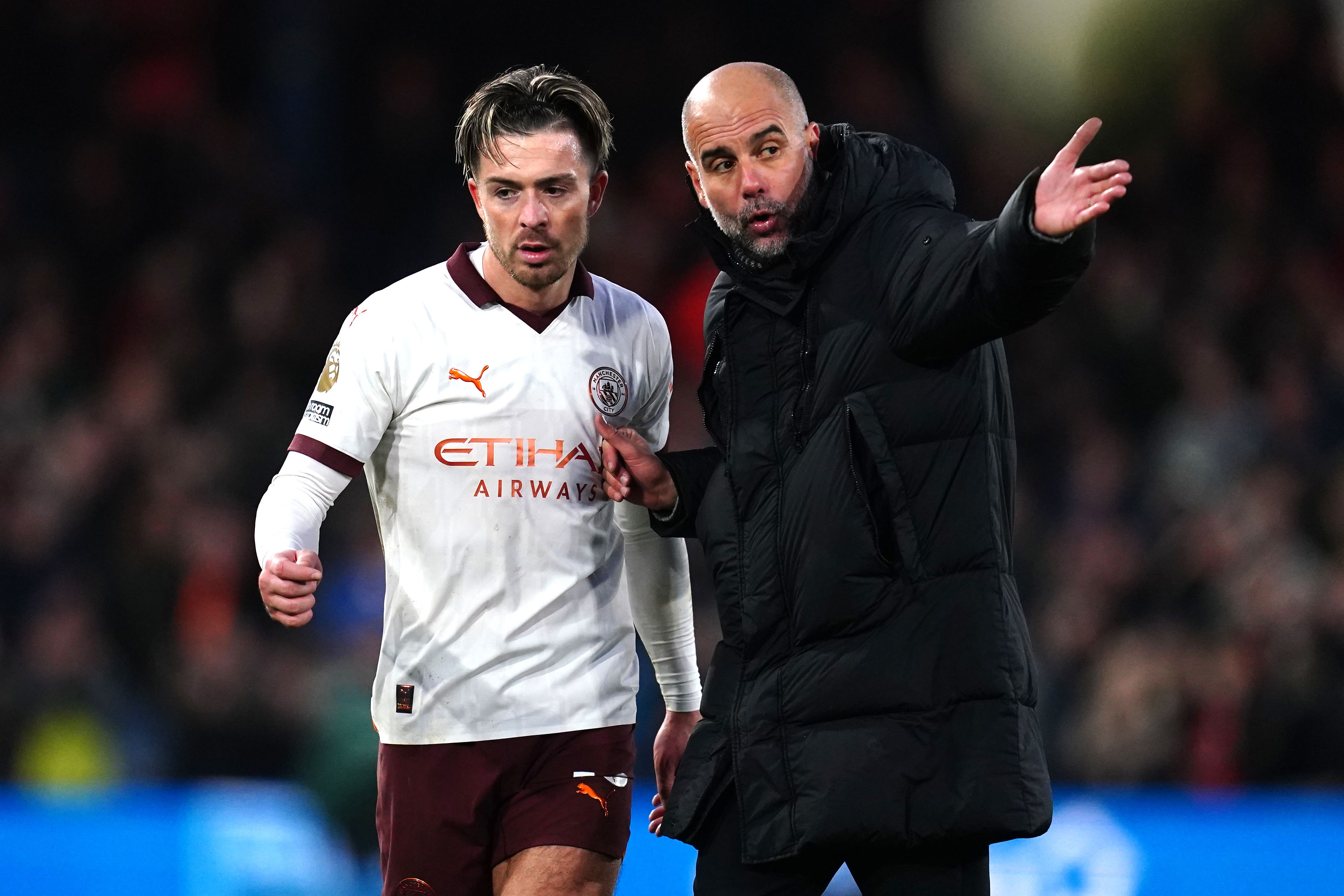 Pep Guardiola (right) has not ruled a Manchester City return for Jack Grealish (left) (Nick Potts/PA)