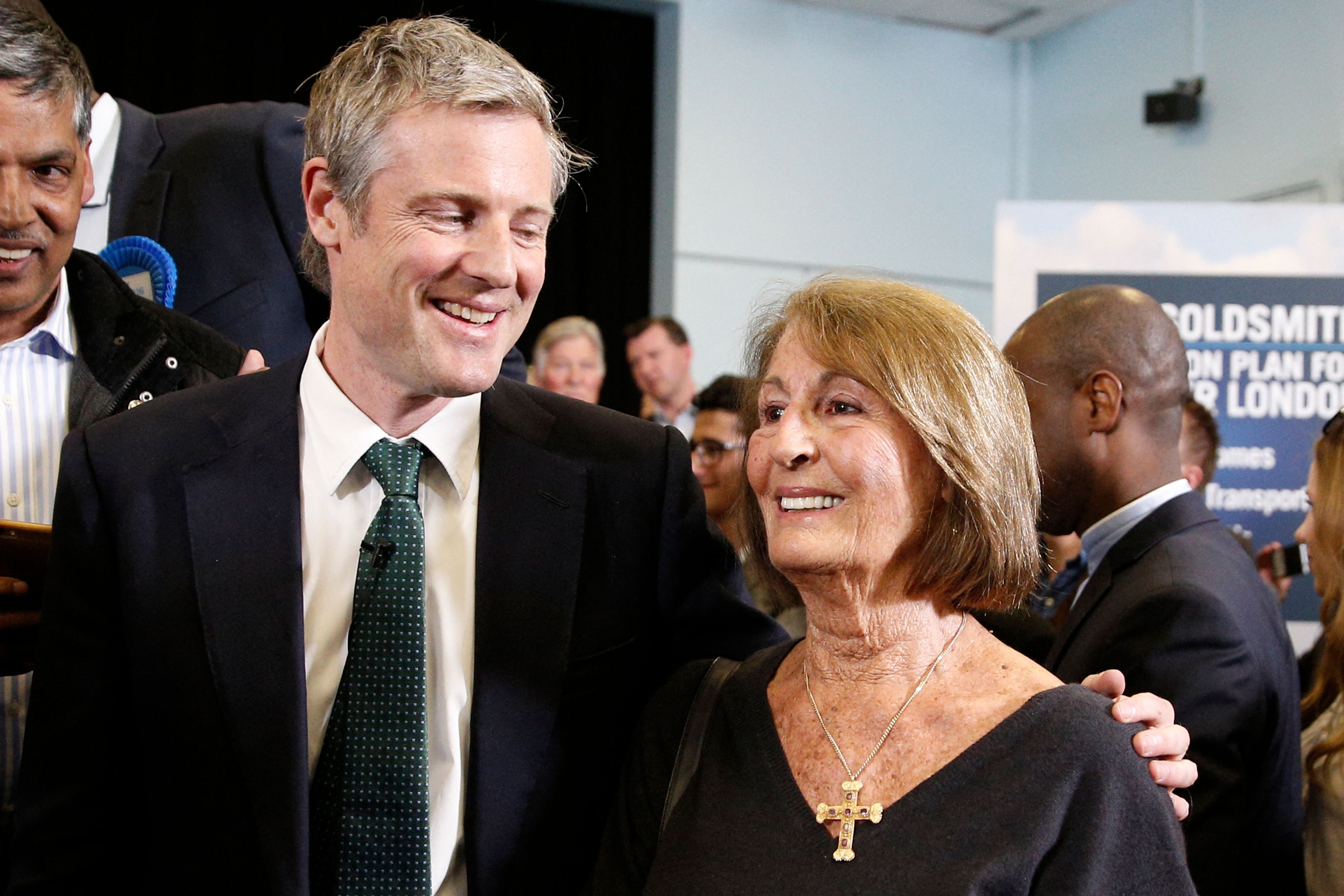 Former London mayoral candidate Zac Goldsmith (L) puts his arm around his mother Lady Annabel Goldsmith (R)