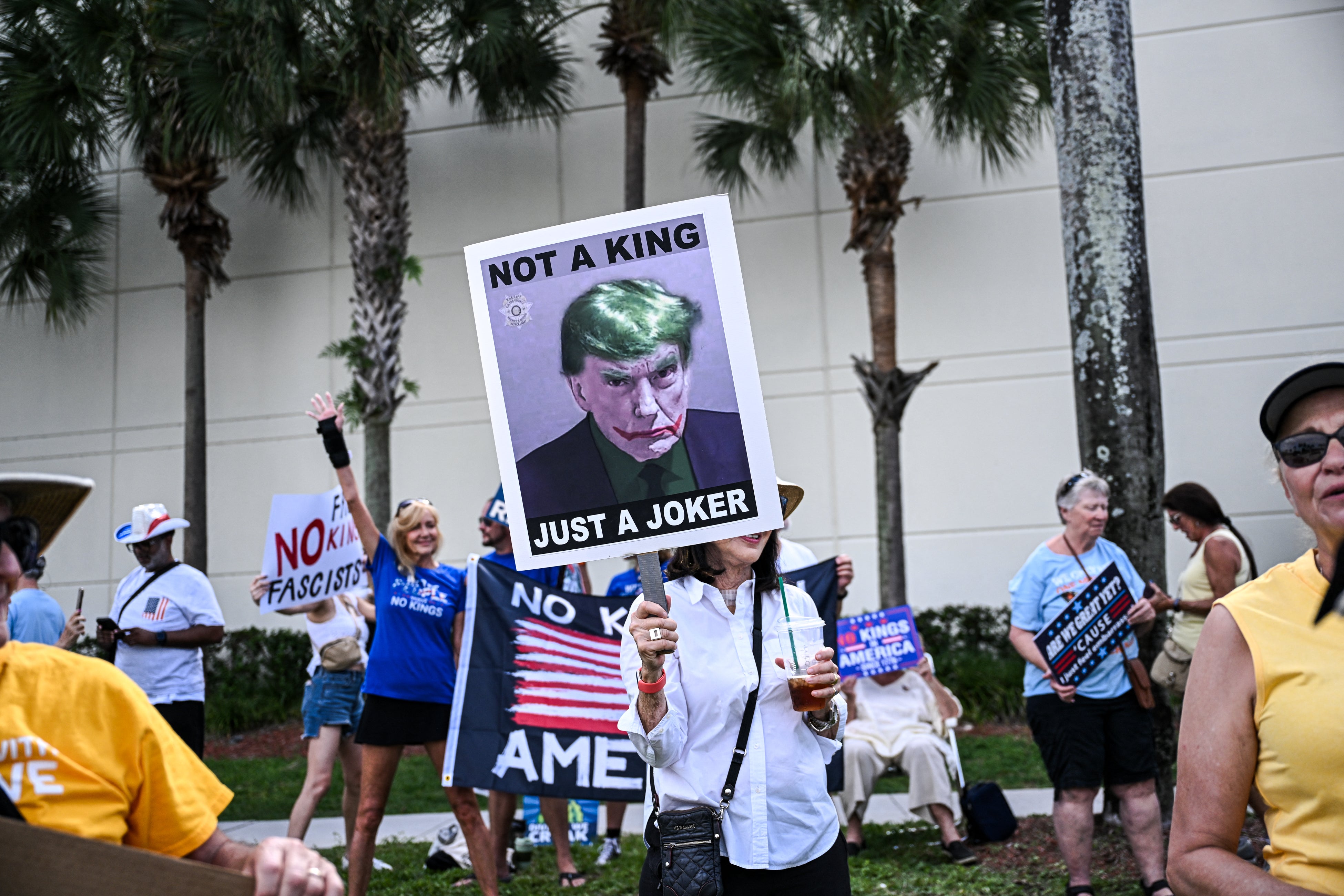 A sign depicting Trump as Batman villain the Joker in West Palm Beach, Florida