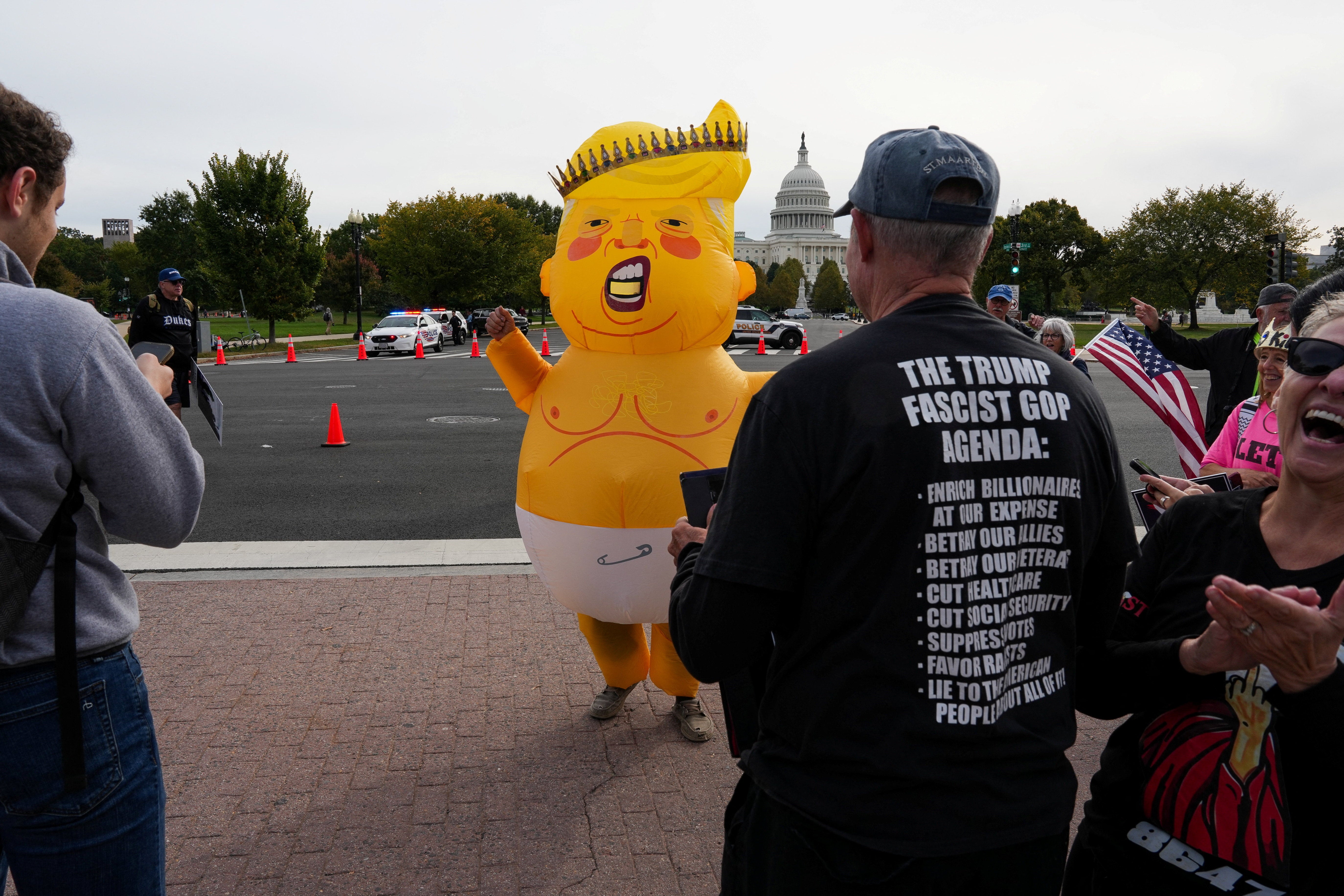 A demonstrator wearing an inflatable costume depicting Trump as a baby