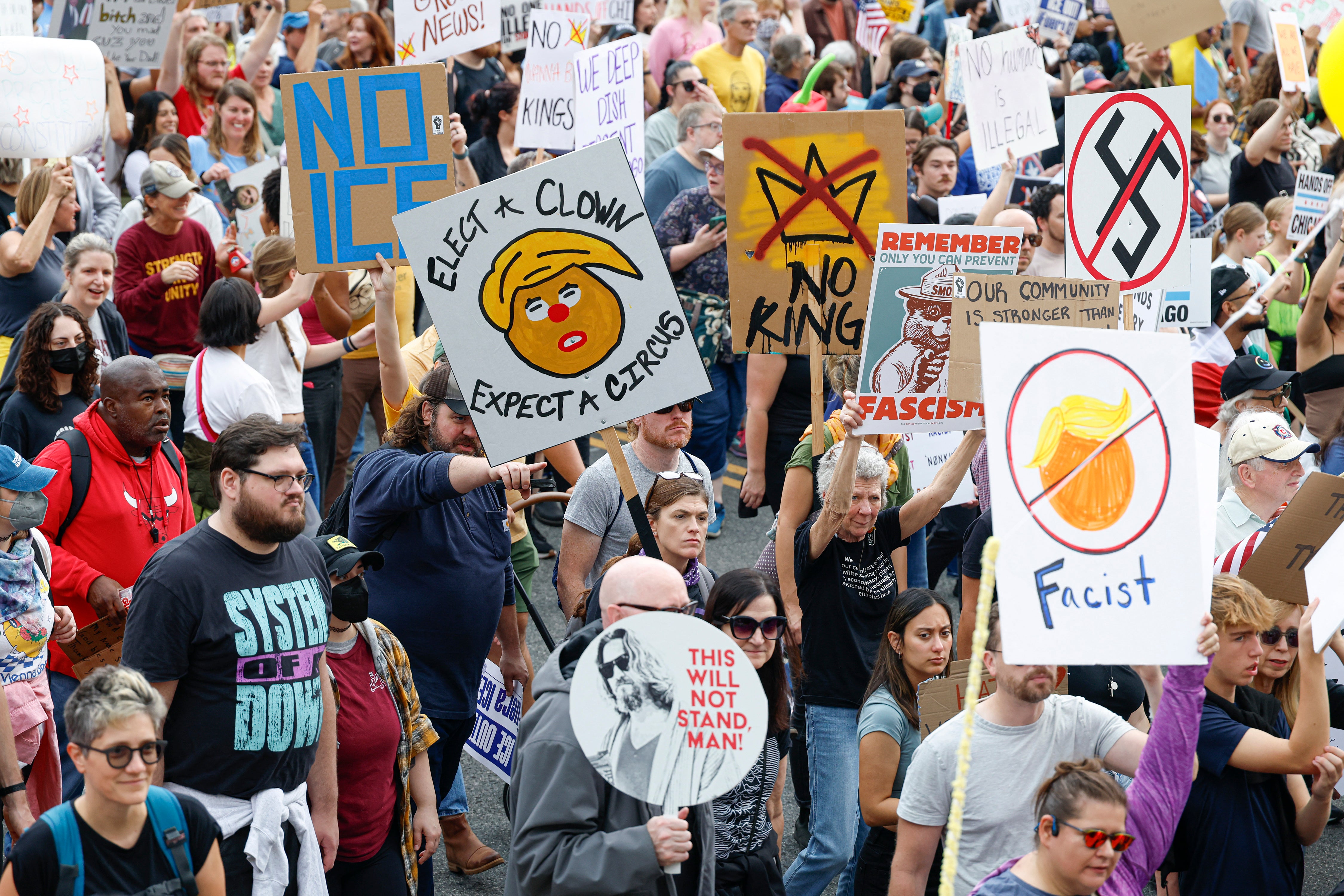 ‘Elect a clown, expect a circus,’ reads one demonstrator’s sign in the Windy City