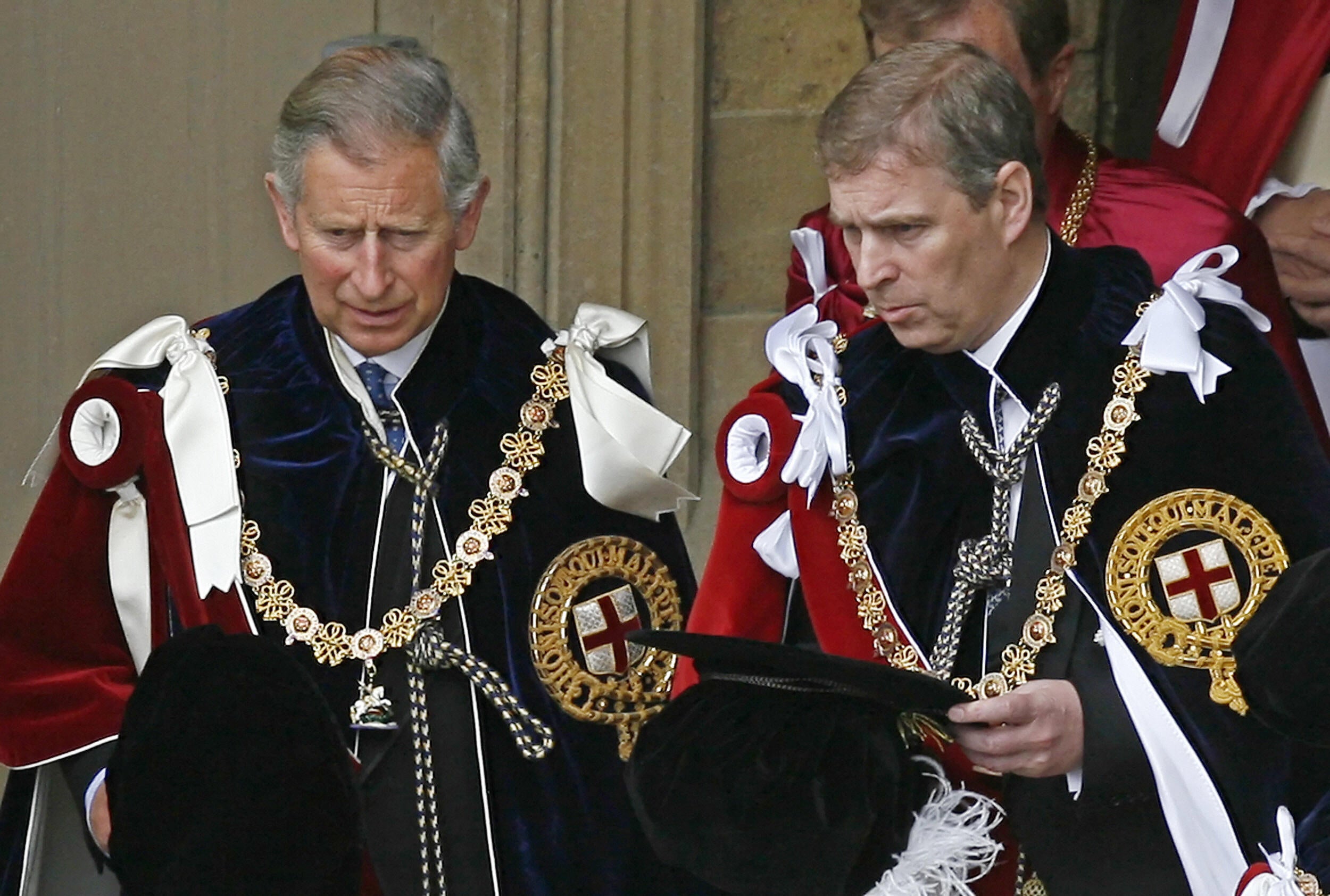 Now-King Charles (L) and then-Prince Andrew depart after attending the Garter service at St George's Chapel at Windsor Castle, in Windsor, in south-east England, 18 June 2007. Andrew has now given up his title of Knight of the Garter.