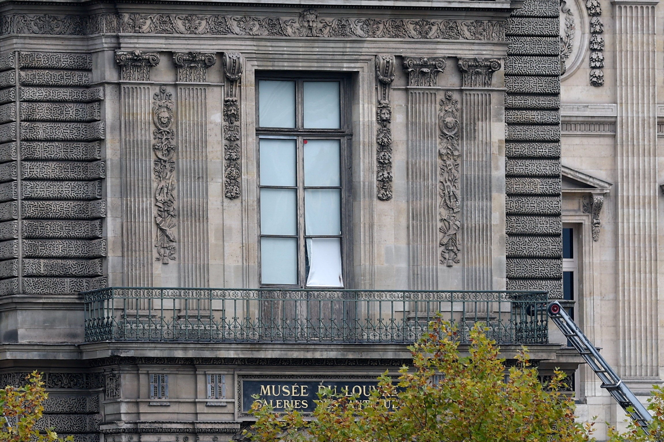 A window believed to have been used in what the French Interior Ministry said was a robbery at the Louvre museum