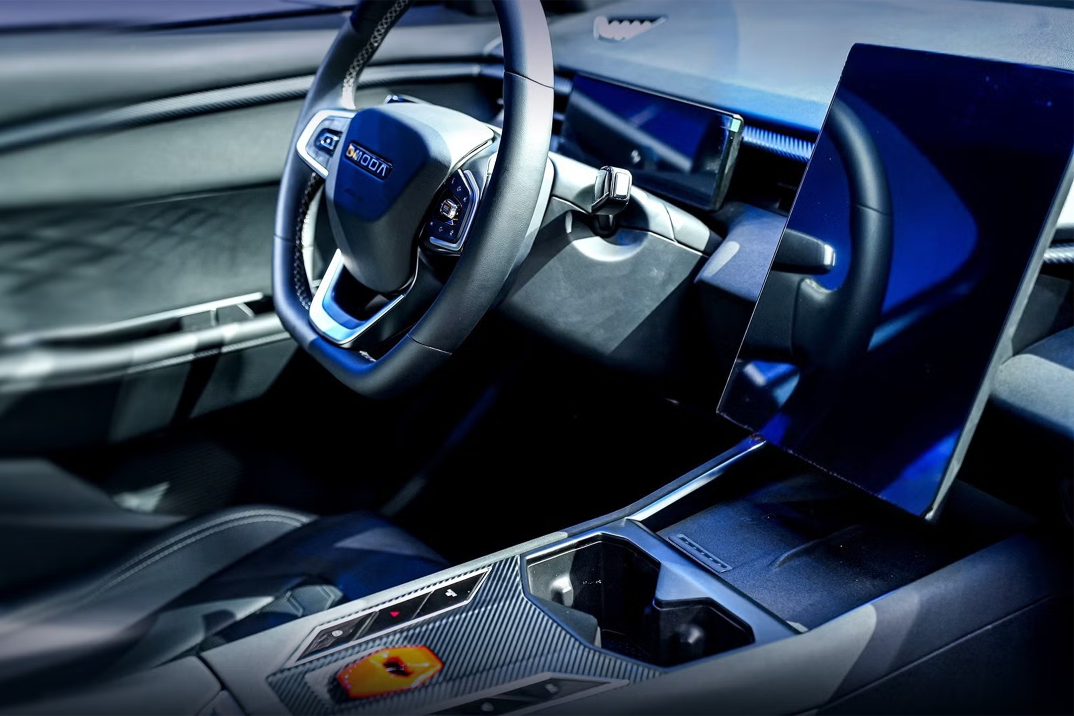 The sci-fi-inspired interior of the Omoda 4 features a Lamborghini style flip switch for the starter button