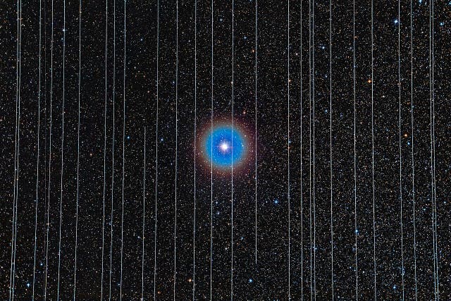 <p>The double star Albireo in Cygnus captured on 26 December 2019. The 2.5-minute exposures recorded Starlink satellites moving across the field</p>