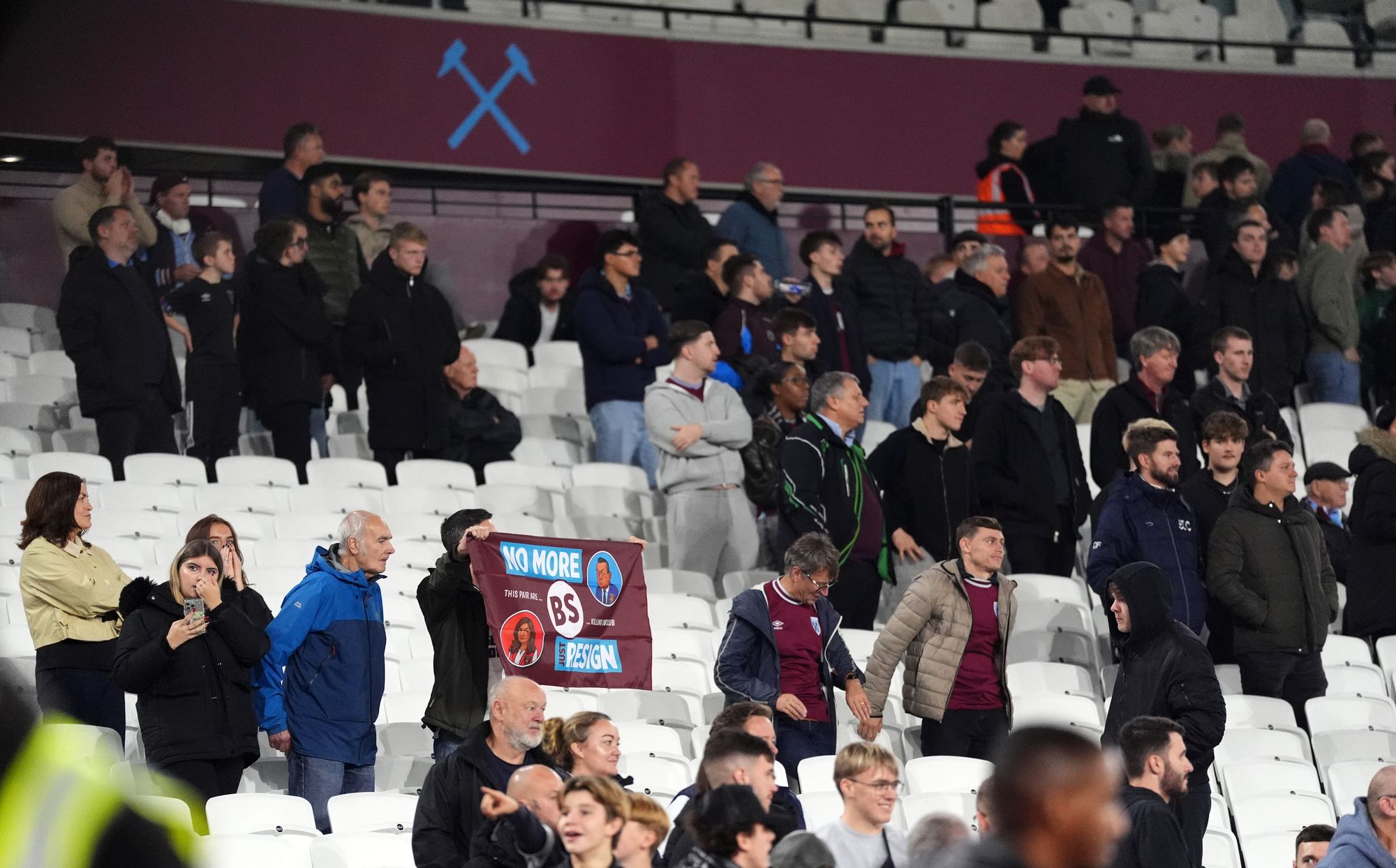 Empty seats and protest banners were dotted around London Stadium