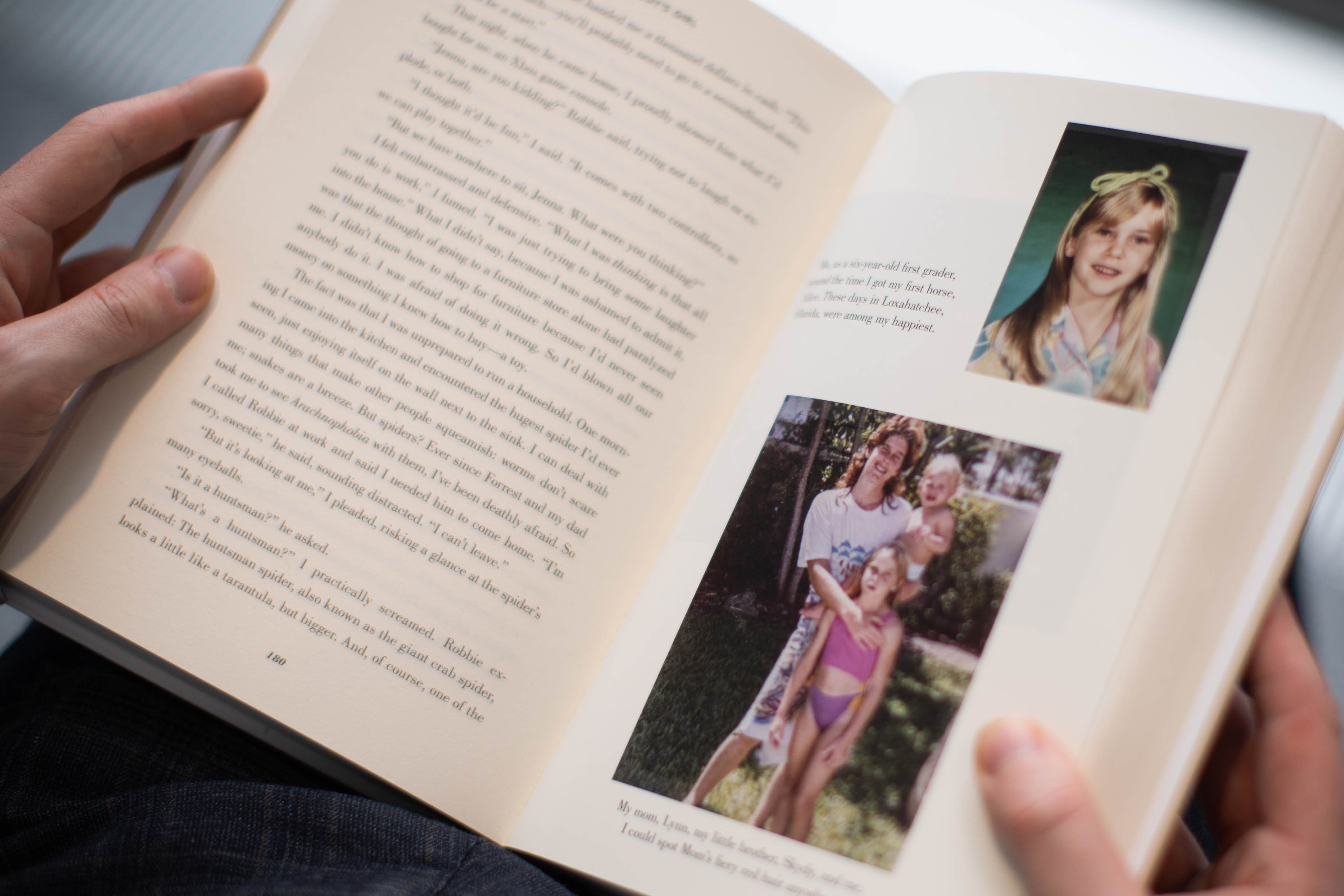 A person reads a copy of Nobody’s Girl by Virginia Roberts Giuffre (James Manning/PA)