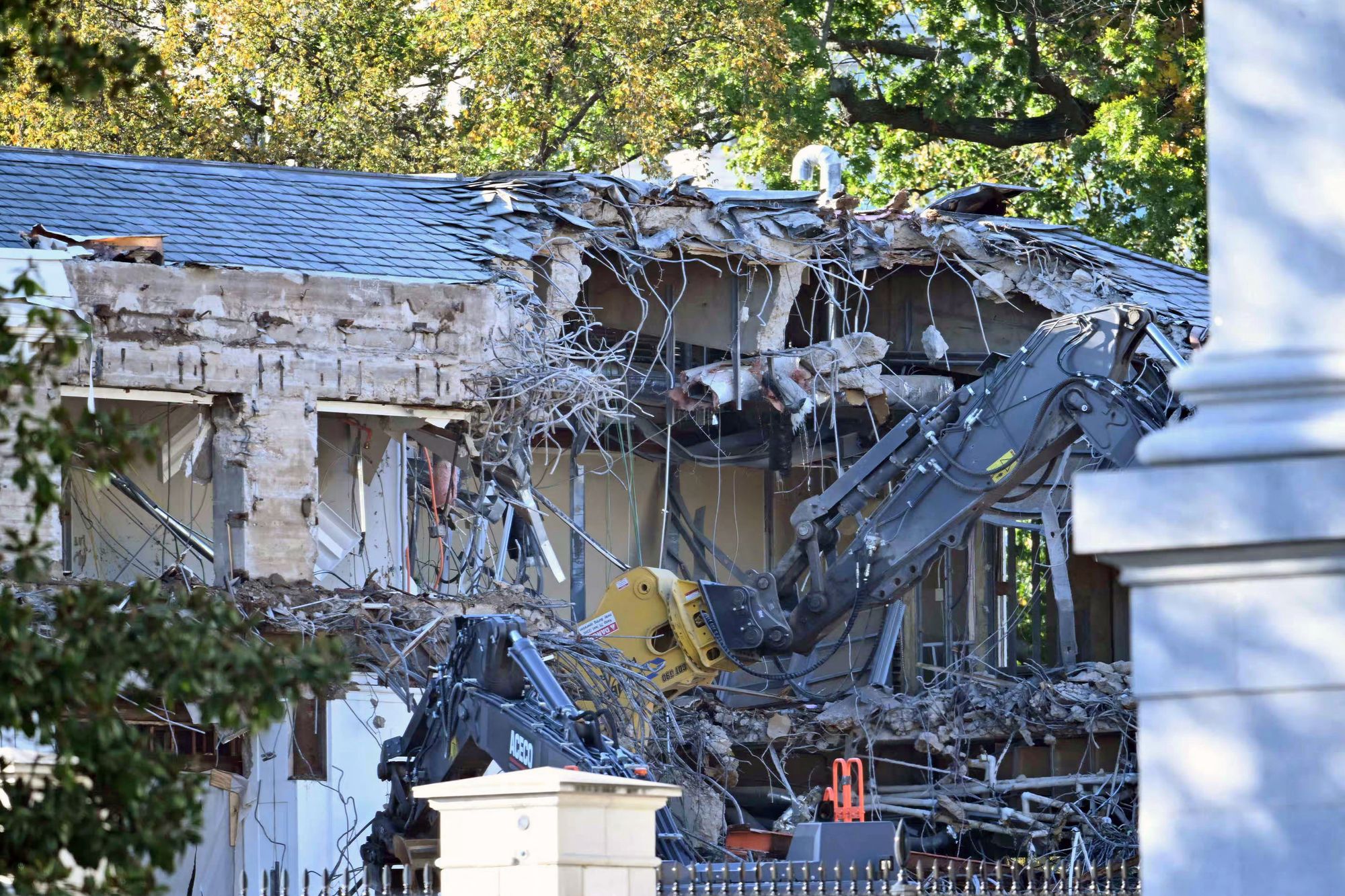 Heavy machinery tears down a section of the East Wing of the White House as construction begins on President Donald Trump's $250m planned ballroom