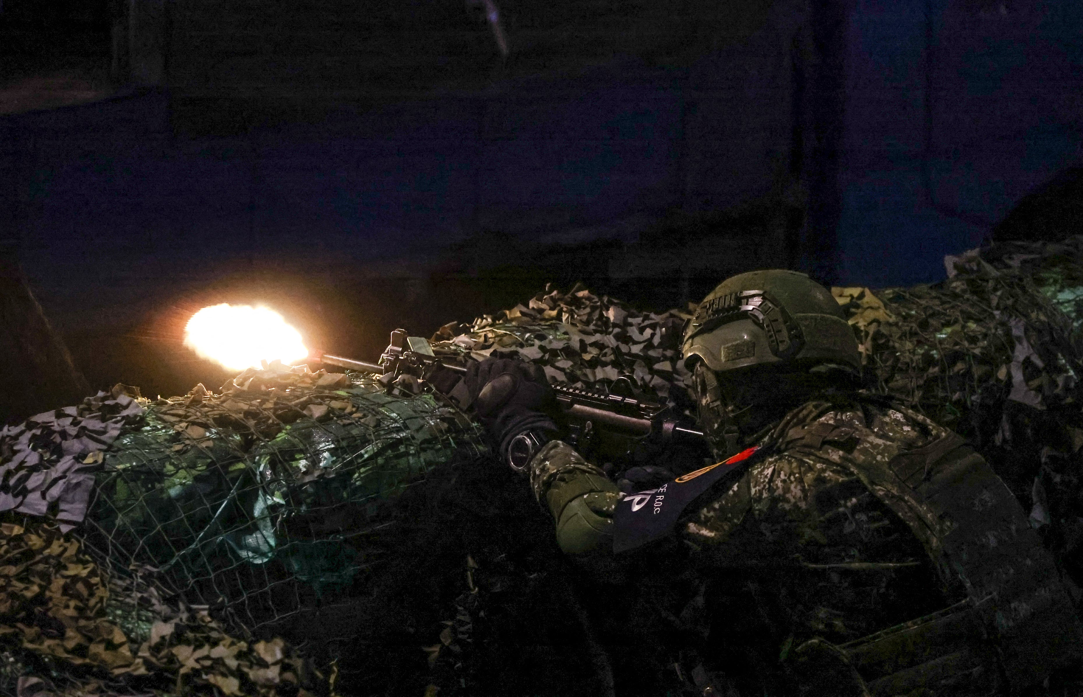 File. Taiwanese soldier fires his weapon during the annual Han Kuang military exercises in Taipei
