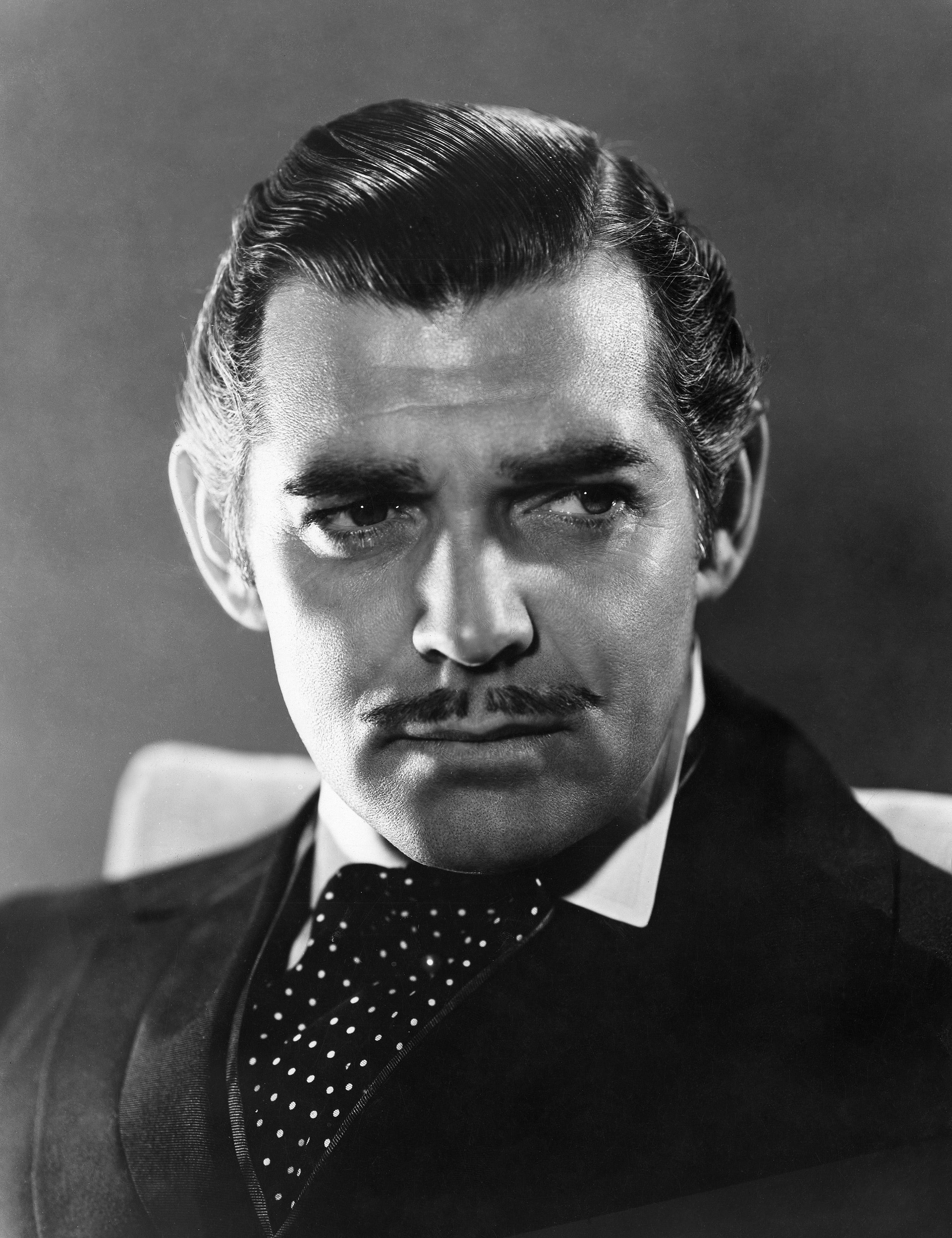 Black and white still from Gone with the Wind of famous moustache wearer Clark Gable