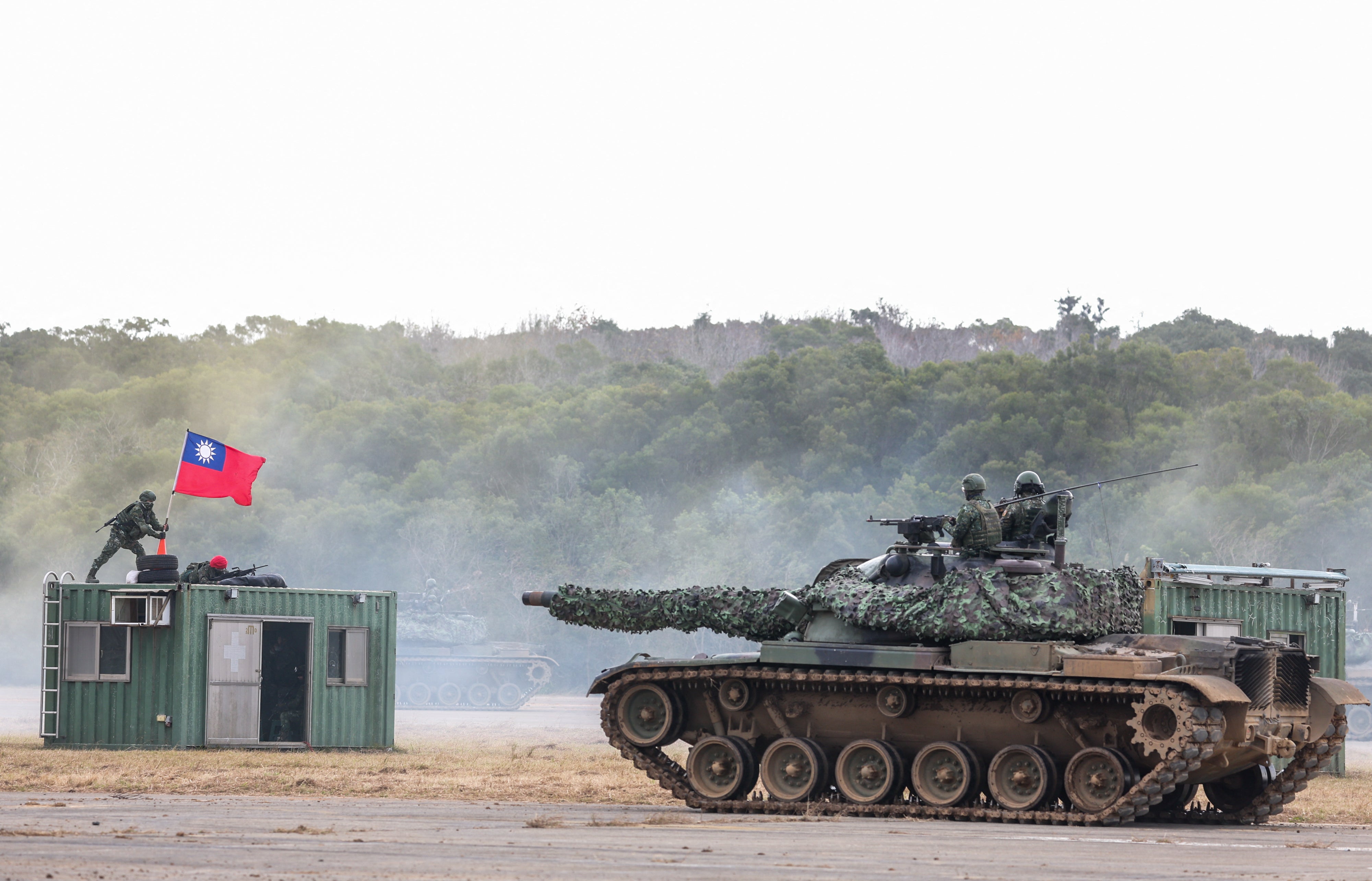 Taiwanese soldiers take part in a drill at the Hukou military base in Hsinchu