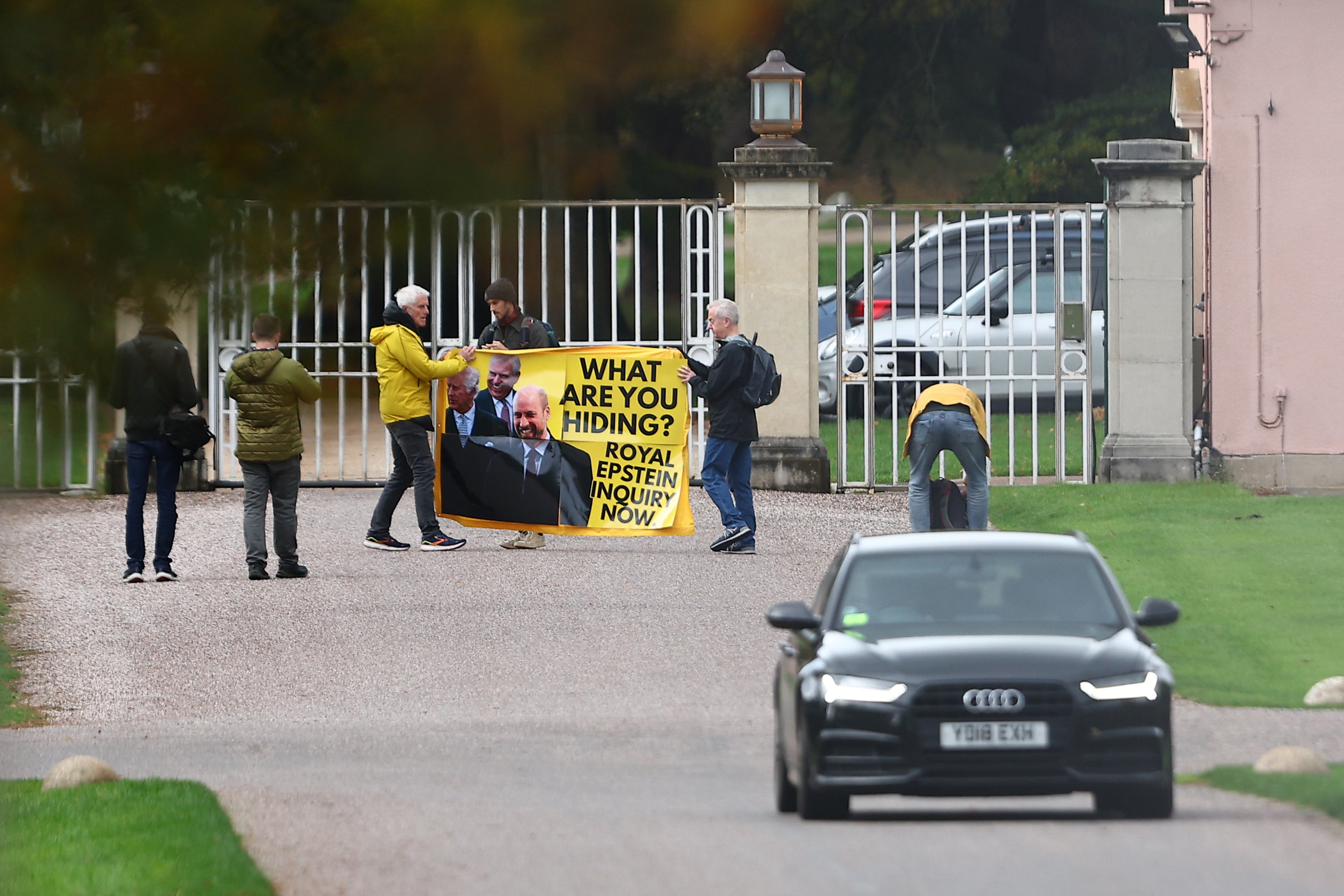 Activists from the anti-monarchy group Republic protest on Tuesday at the gates to Royal Lodge where Prince Andrew lives