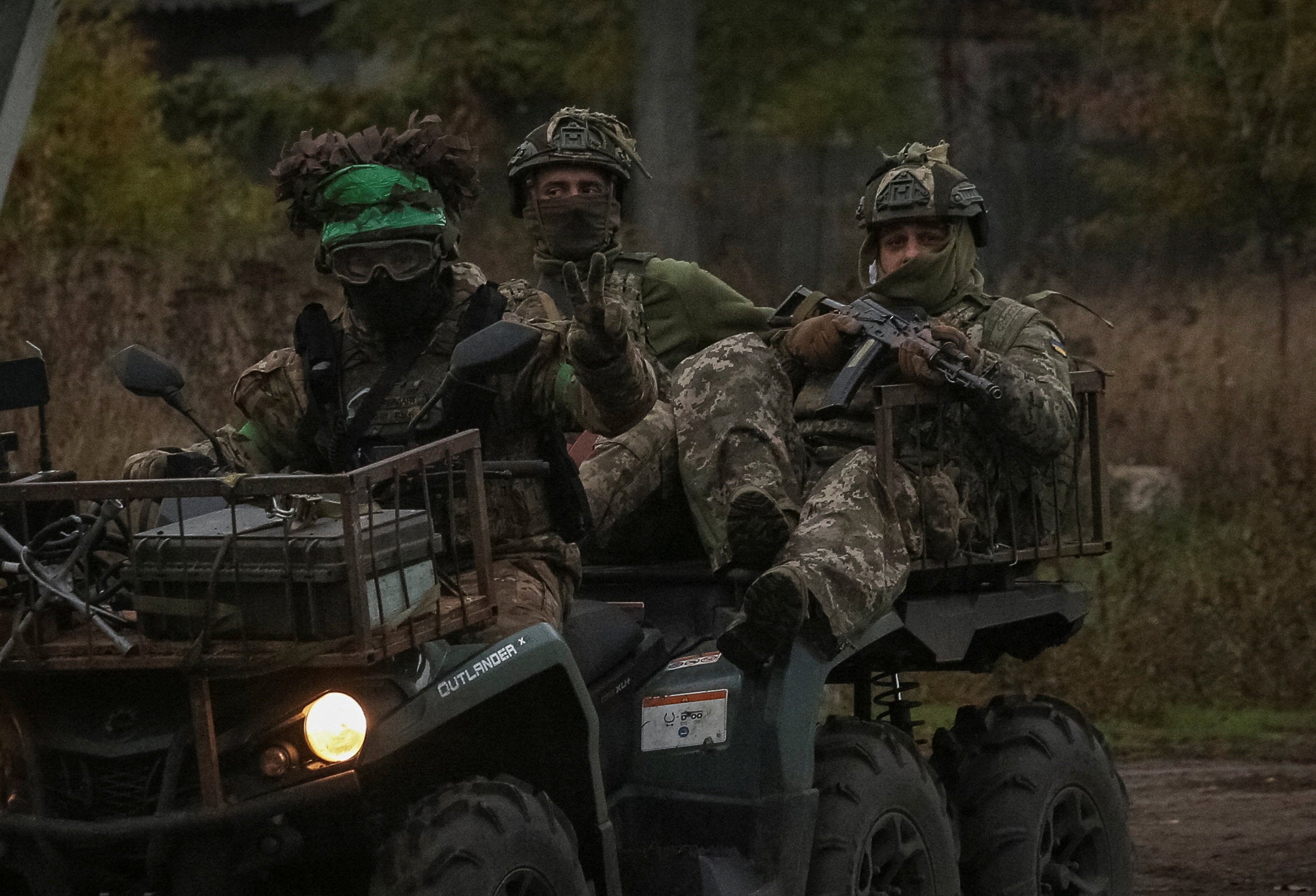 Ukrainian servicemen ride a military buggy, amid Russia’s attack on Ukraine, in the Donetsk region
