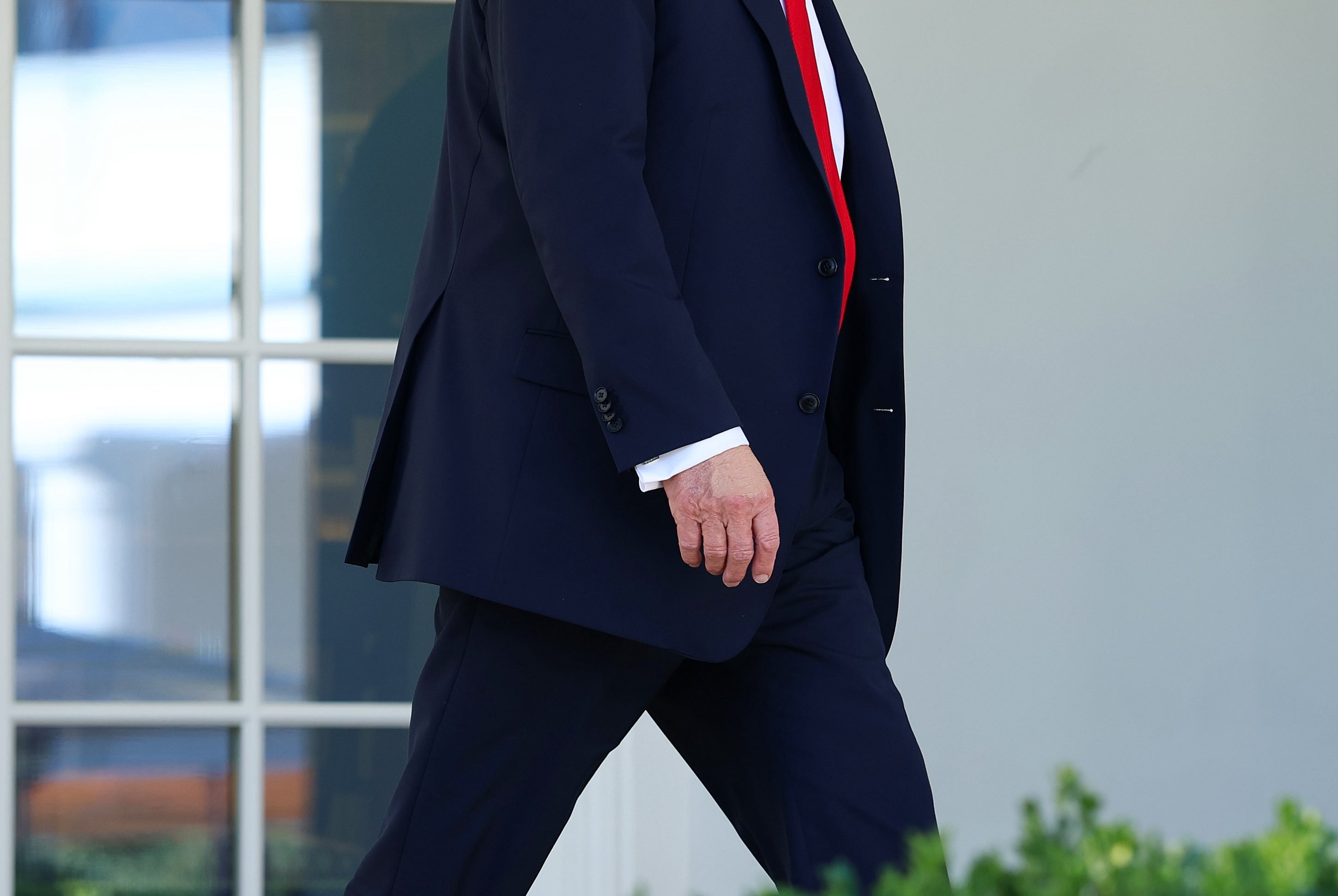 Trump’s right hand, seen on Tuesday, appeared to have makeup on it – seemingly covering the hand-bruising the president experiences