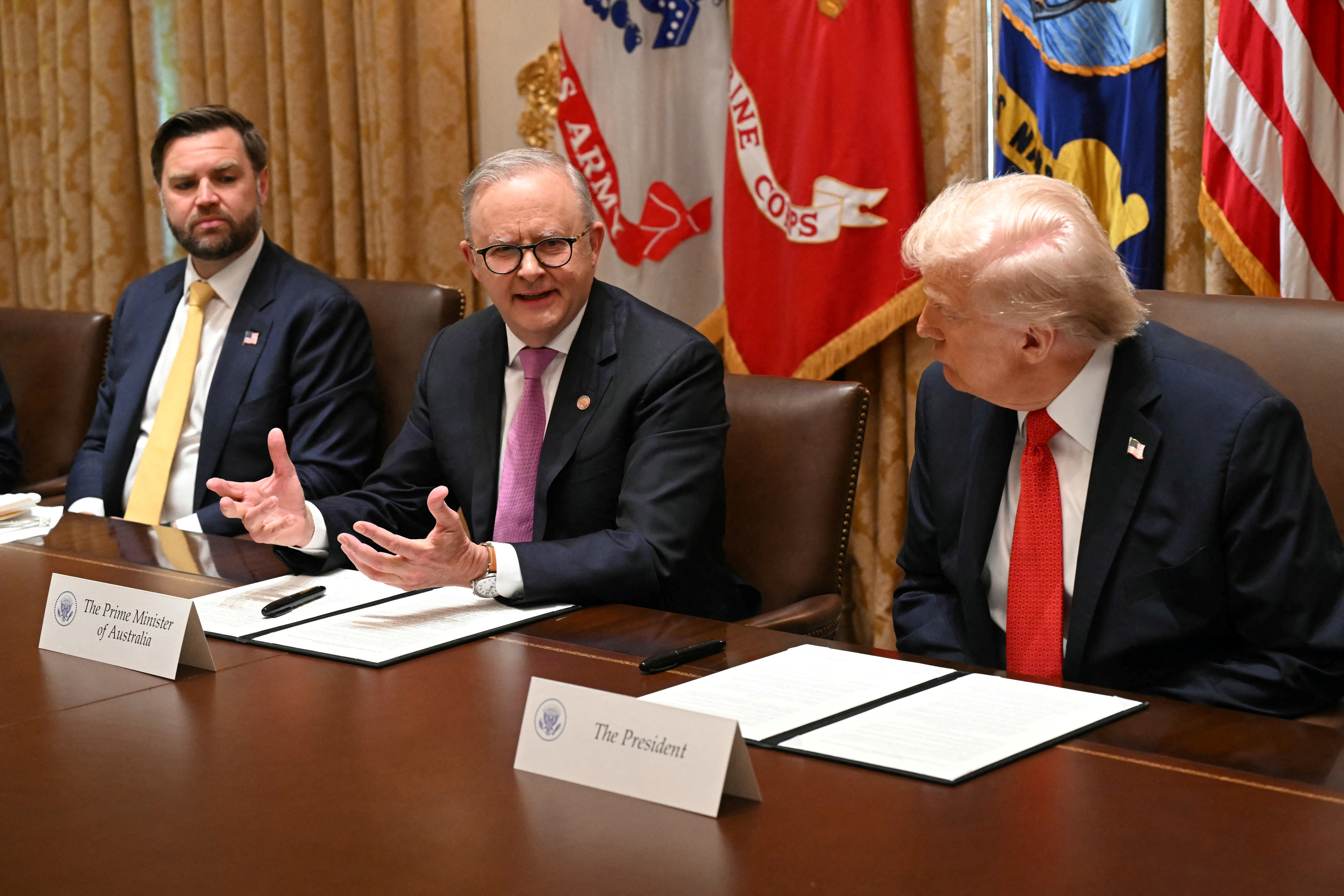 Donald Trump listens to Anthony Albanese as US vice president JD Vance looks on in the Cabinet Room at the White House on 20 October 2025