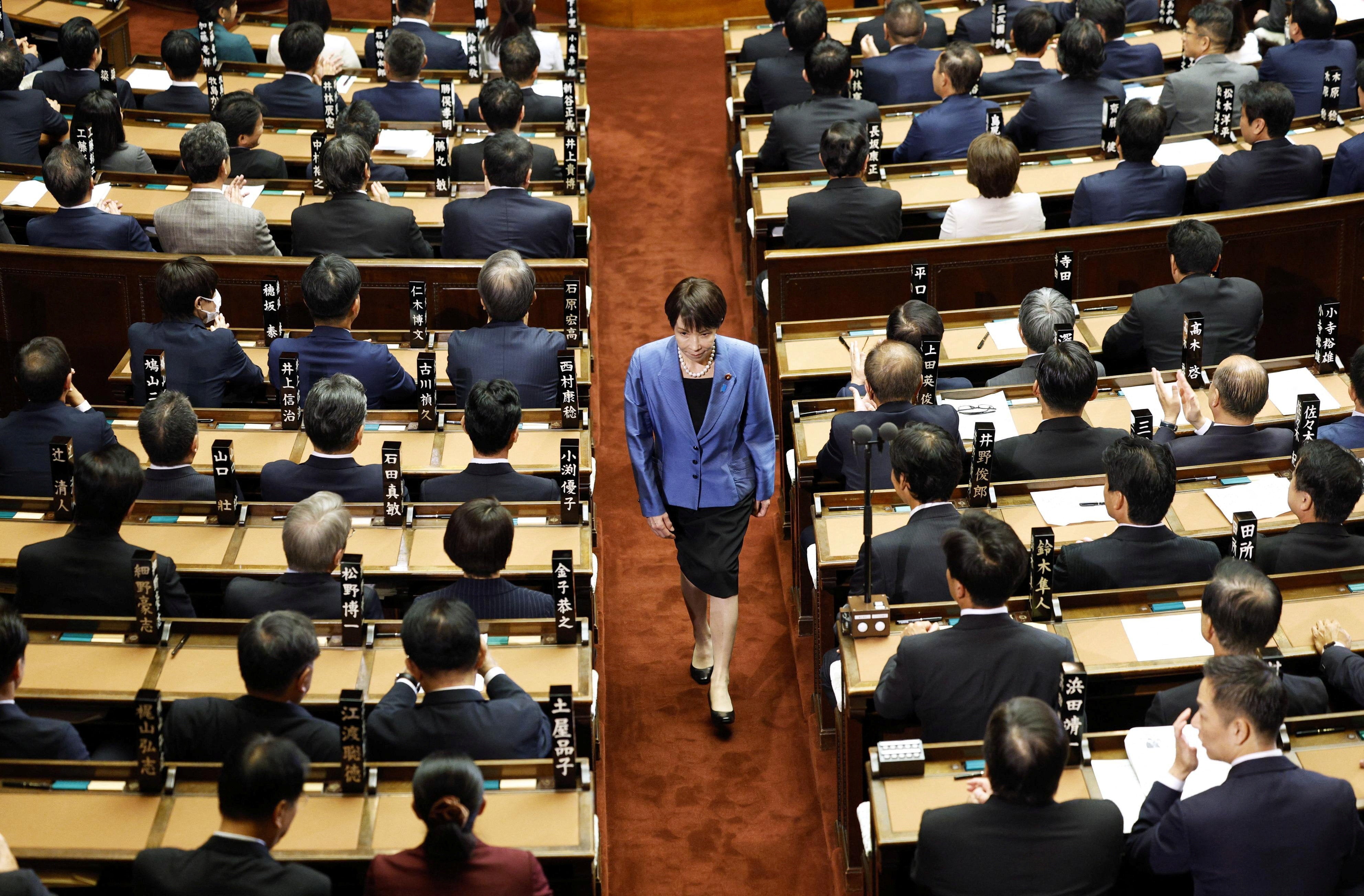 Sanae Takaichi, leader of the ruling Liberal Democratic Party, walks after casting a vote in an election to choose Japan's next prime minister at the Lower House of Parliament in Tokyo, Japan, 21 October 2025