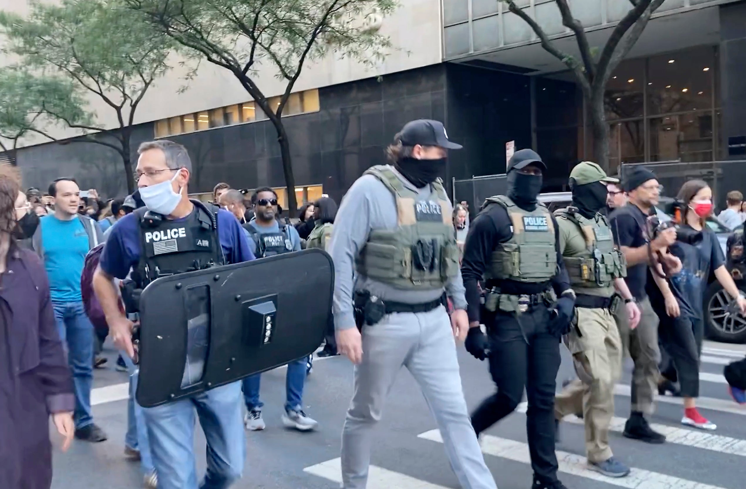 Additional federal agents, armed in combat gear and carrying long guns, also arrived with a military tactical vehicle known as a BearCat and made additional arrests