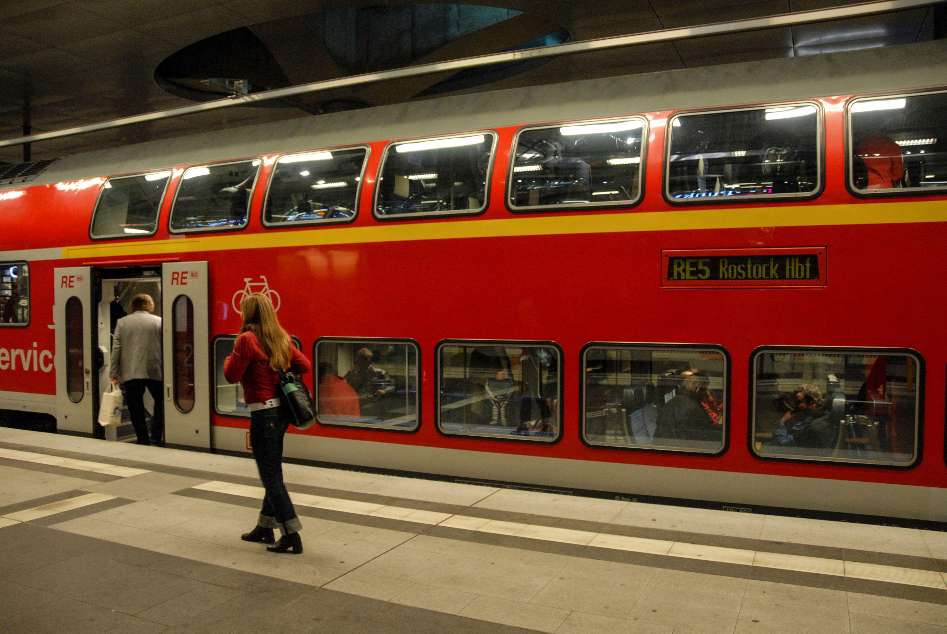 A regional double-decker passenger train at Berlin Hauptbahnhof