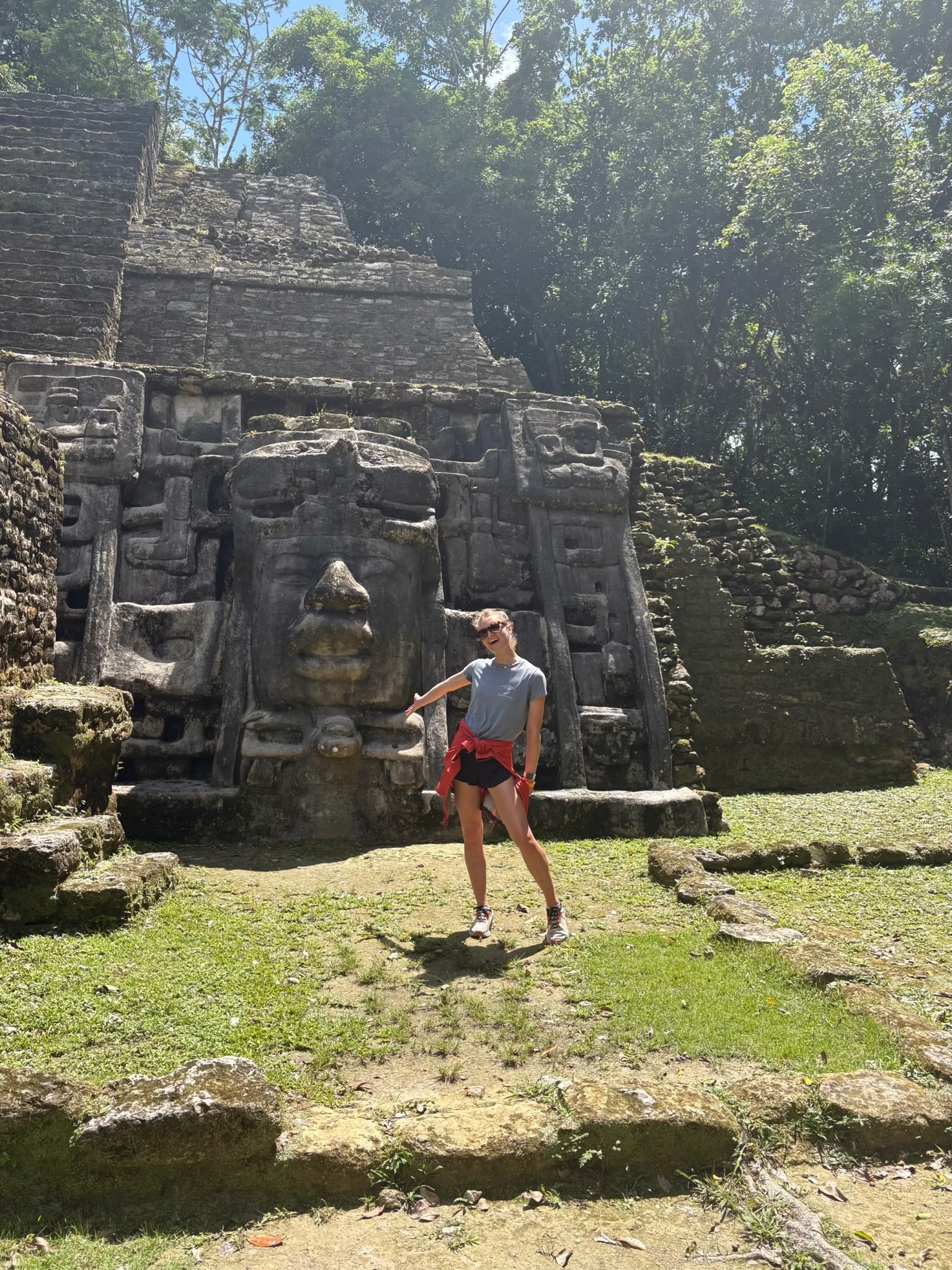 Writer Lara in front of a Mayan Ruin in Belize