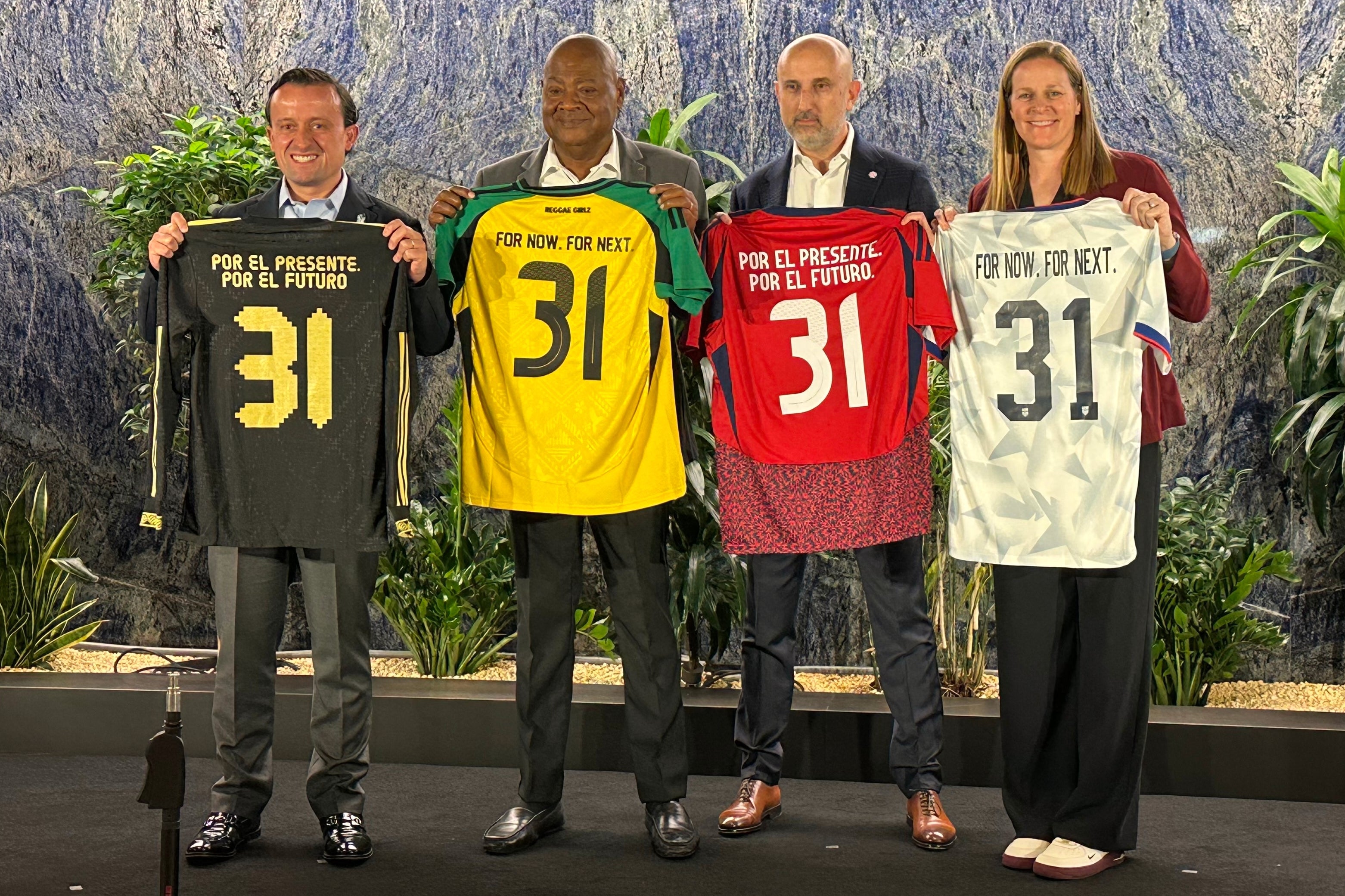 From left to right, Mexican Football Federation president Mikel Arriola, Jamaica Football Federation president Michael Ricketts, Costa Rican Football Federation president Osael Maroto MartÃ­nez and U.S. Soccer president Cindy Parlow Cone pose with jerseys at a news conference