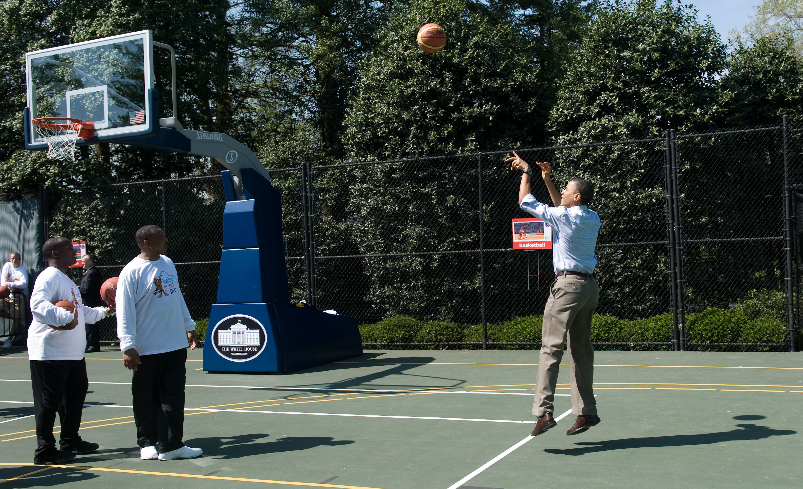 US President Barack Obama shoots a basketball during the annual White House Easter Egg Roll on the South Lawn of the White House in Washington on April 5 2010