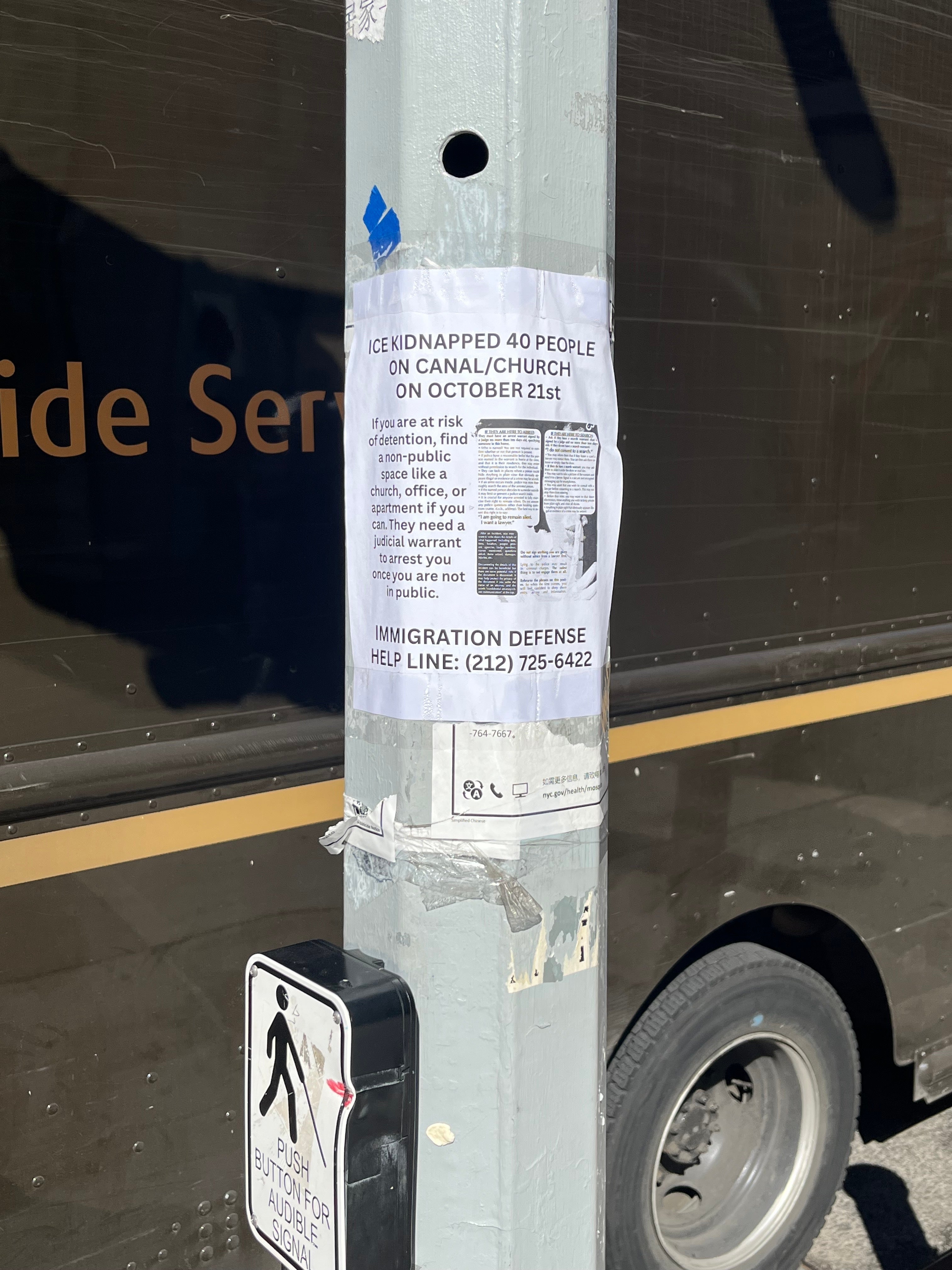 The day after the raid, signs were posted near Canal Street to tell migrants about ways to avoid ICE arrests without a warrant.