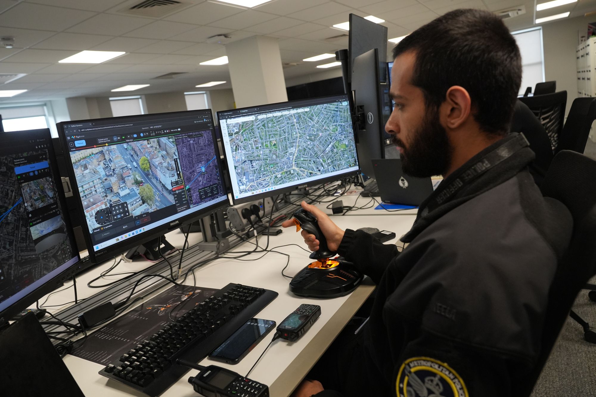 A police officer pilots a drone during a demonstration of the Metropolitan Police's new Drone as First Responder (DFR) pilot programme