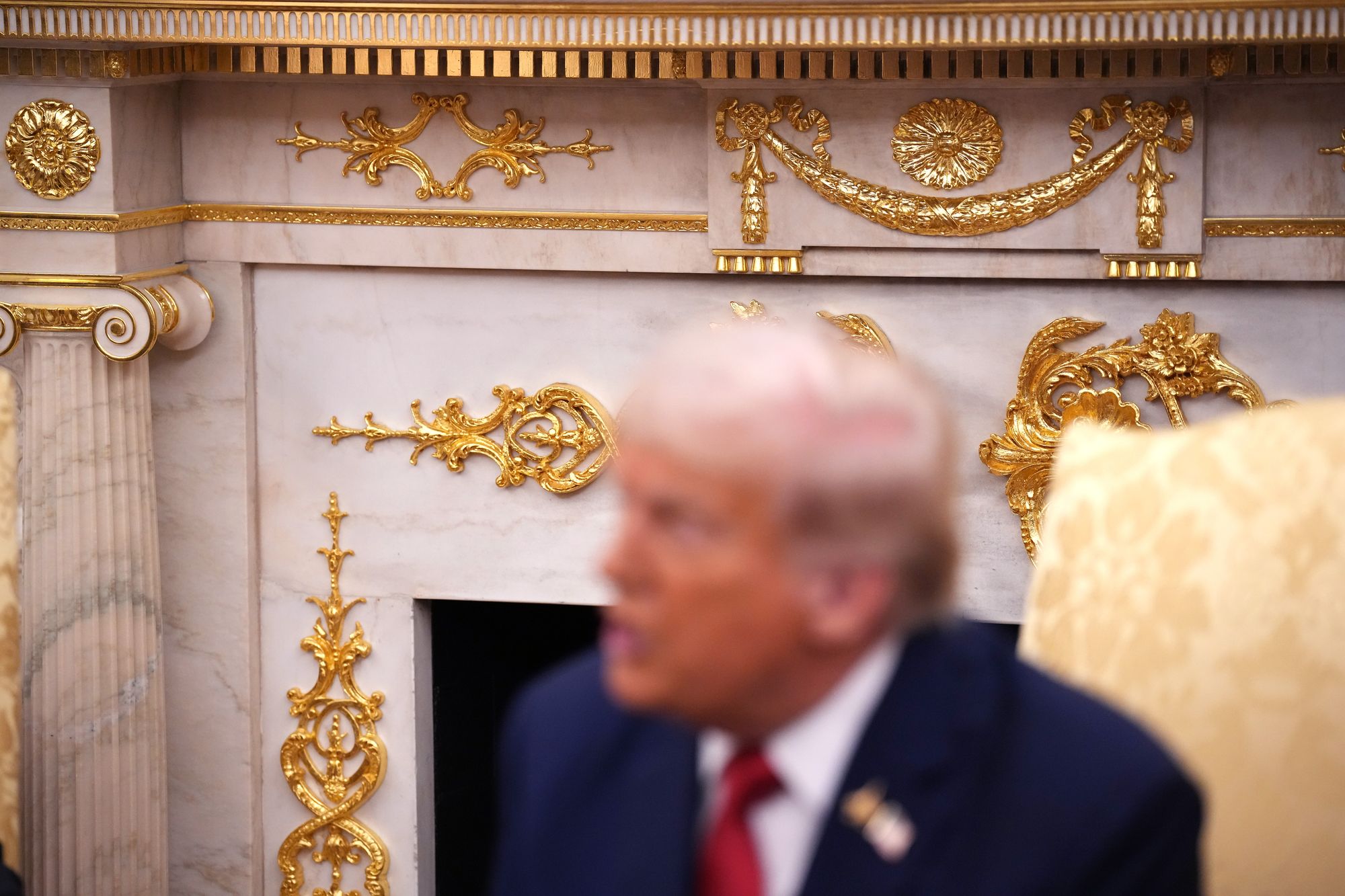 Gold leafing is seen on the mantle in the Oval Office