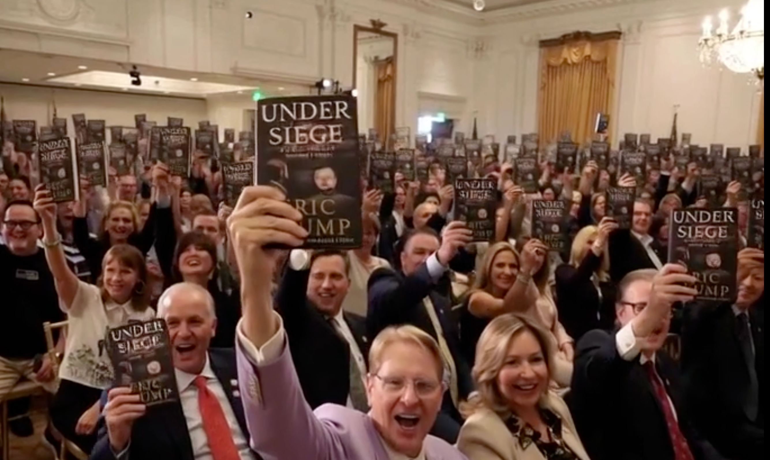 Eric Trump posted an AI-generated video of a crowd of supporters lifting his new memoir and cheering to promote the book