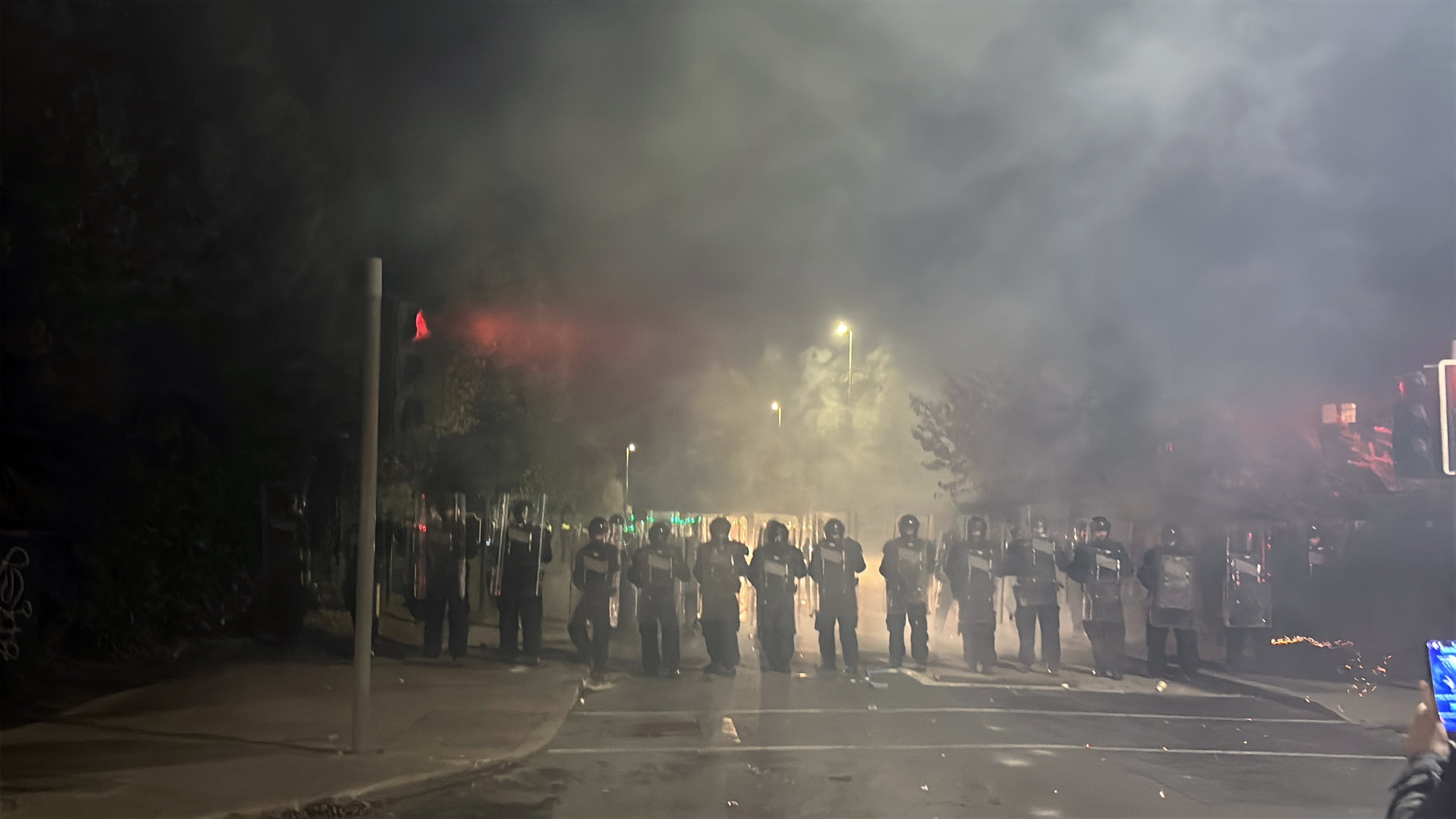 Public order gardai pushed the crowd further from the hotel by advancing on them with shields